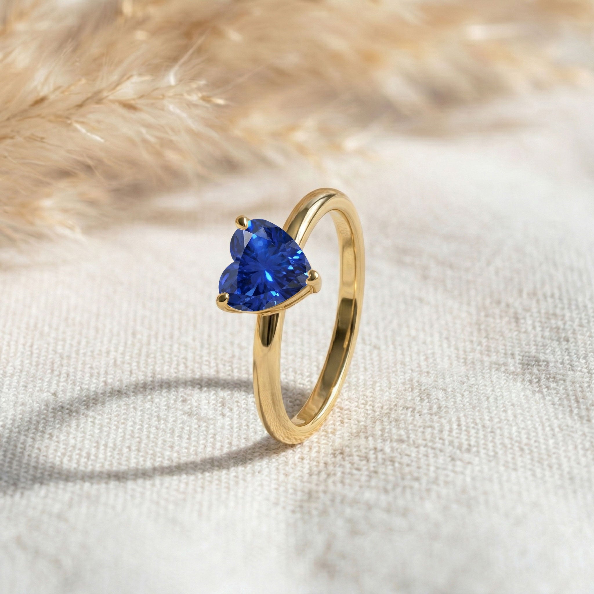 heart shaped sapphire ring, blue gemstone solitaire, sterling silver jewellery, handcrafted engagement ring, gold filled jewellery option, elegant romantic accessory, women's anniversary gift, polished heart gemstone, promise ring jewellery, minimalist fashion band, september birthstone design, luxury handmade jewellery, classic ring, artisan gift, fine accessory