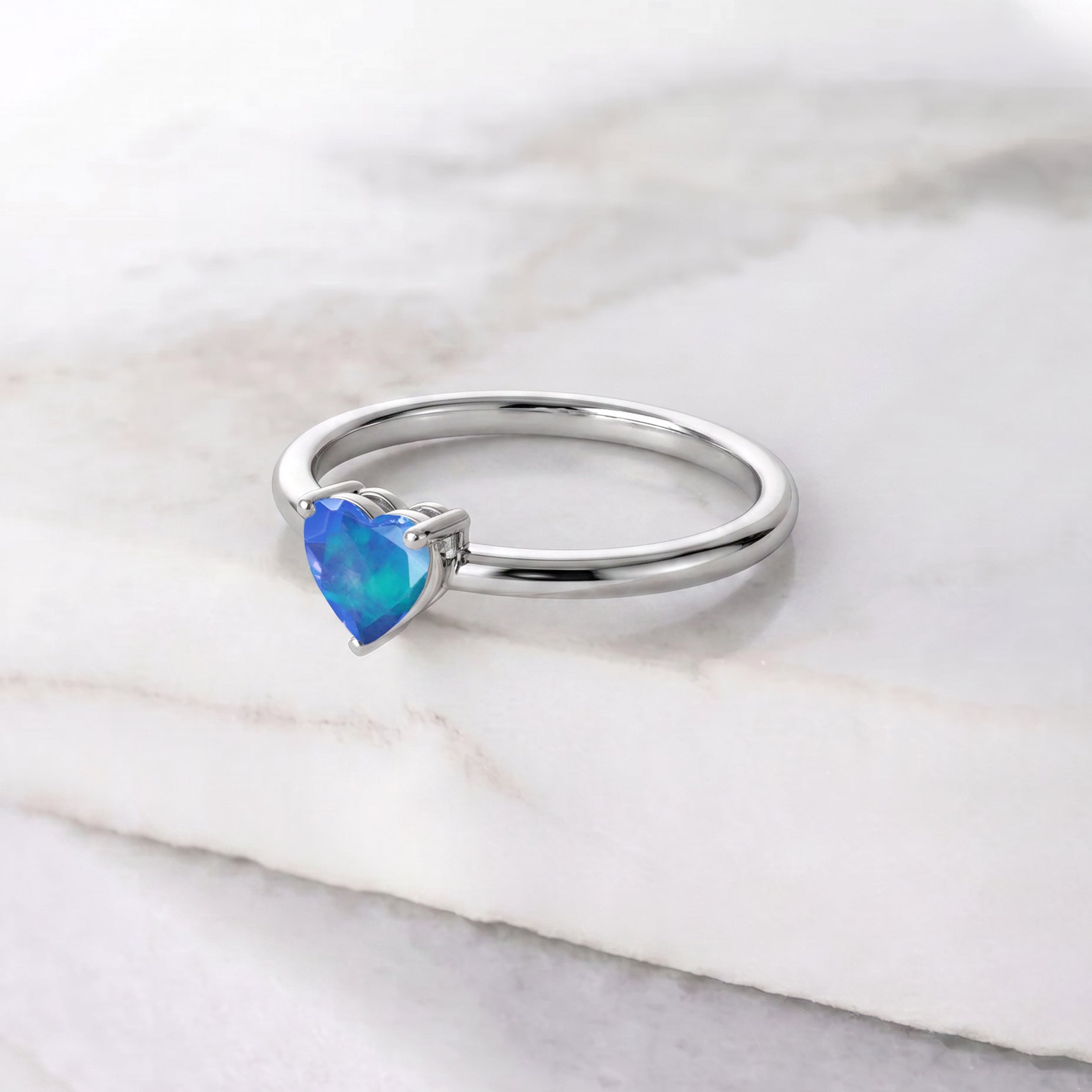 Natural Blue Opal solitaire jewelry, heart gemstone accessory, elegant women's fashion ring, fine gemstone gift, polished jewelry design, artisan crafted ring, meaningful jewelry gift, anniversary present, birthday gemstone jewelry, sophisticated accessory, delicate gemstone style, heart jewelry, premium gemstone, timeless elegance, refined craftsmanship