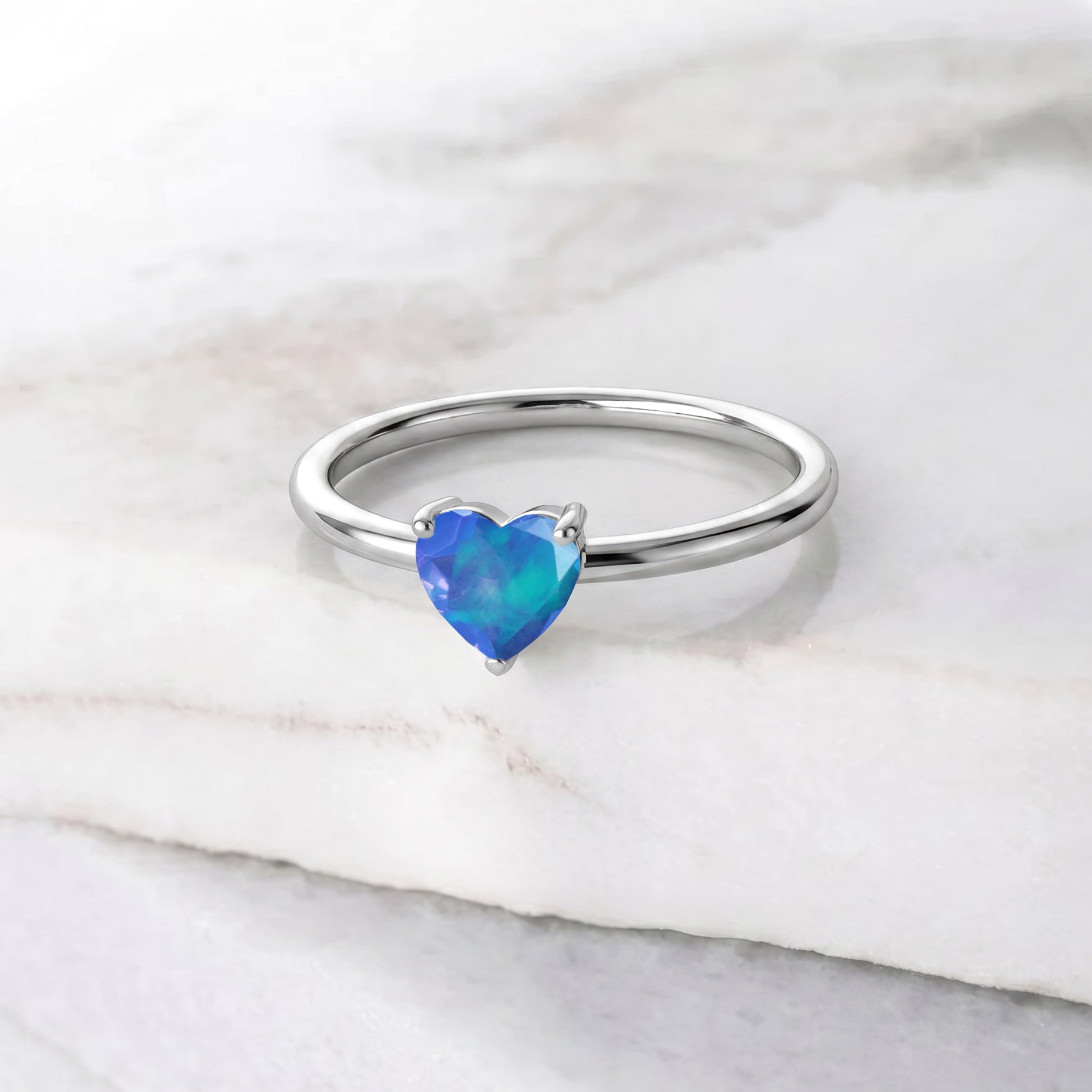 Blue Opal promise ring, natural gemstone jewelry, heart cut solitaire, October gemstone ring, elegant women's jewelry, minimalist gemstone ring, classic heart design, fine jewelry piece, handcrafted gemstone, everyday luxury ring, stylish jewelry, anniversary jewelry, birthday gift, feminine jewelry, stackable style