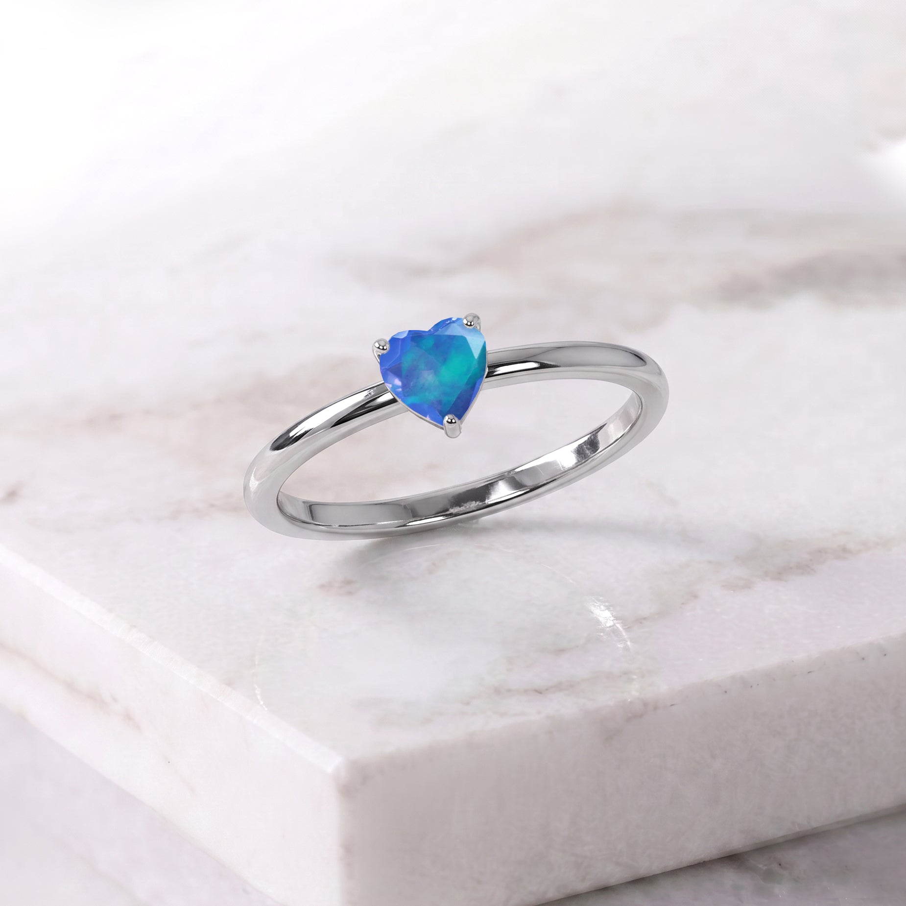 Heart gemstone jewelry, Blue Opal ring for women, elegant solitaire accessory, artisan gemstone craftsmanship, October birthstone collectible, unique gemstone jewelry, romantic fashion ring, handcrafted elegance, premium jewelry gift, everyday sophistication, feminine gemstone accessory, polished ring design, luxury jewelry piece, classic style, timeless keepsake