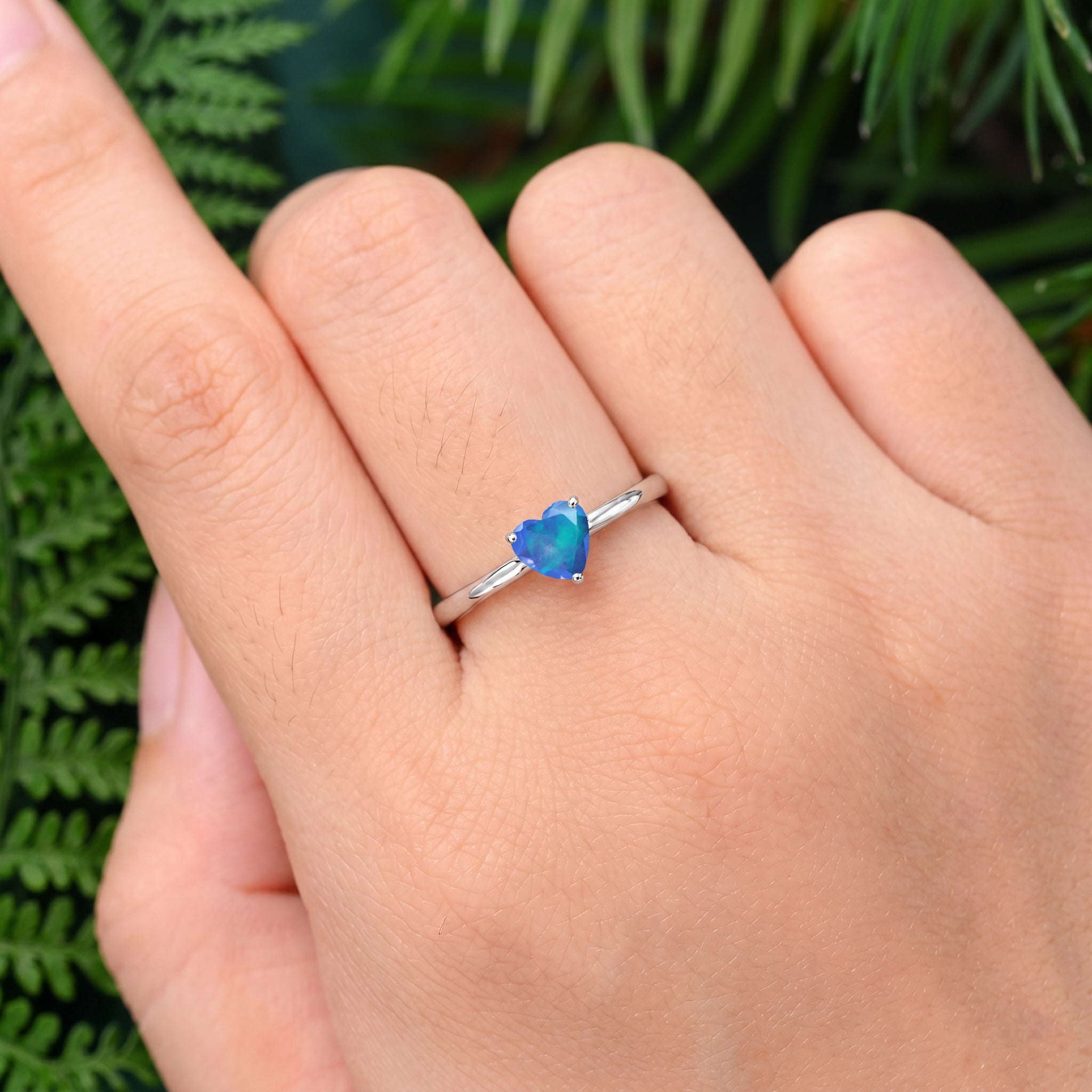 Heart Blue Opal gemstone ring, dainty solitaire jewelry, October birthstone jewelry, women's fashion ring, elegant heart jewelry, gemstone gift, romantic jewelry, handcrafted ring design, modern solitaire style, blue gemstone accessory, everyday elegance, fine jewelry gift, unique gemstone ring, delicate jewelry, timeless accessory