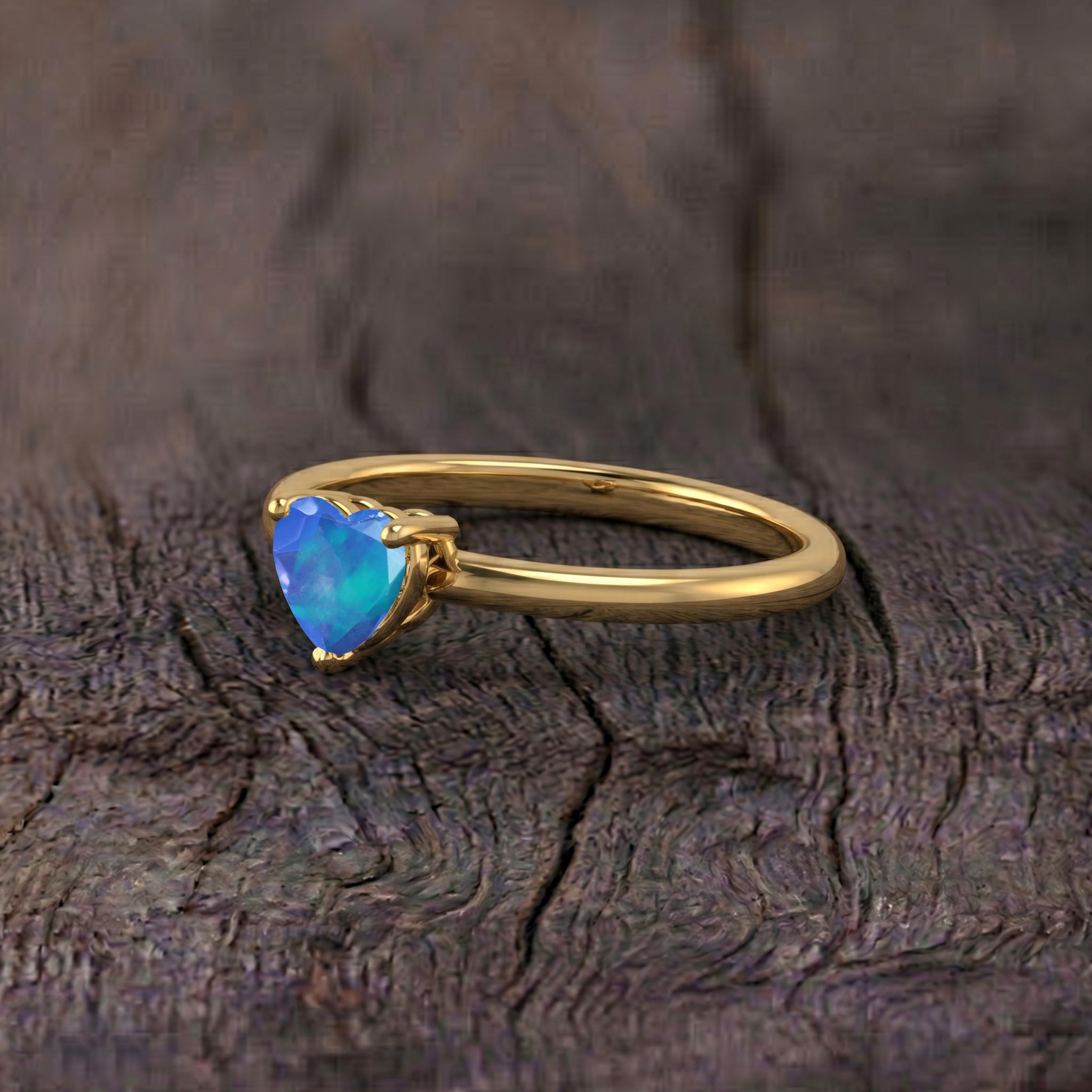 Blue Opal fine jewelry, solitaire heart gemstone, artisan gemstone ring, elegant blue ring, birthday present jewelry, anniversary keepsake, heart shaped opal, women's luxury jewelry, handcrafted accessory, gemstone fashion ring, sophisticated jewelry, unique blue gemstone, refined design, collectible jewelry, classic elegance