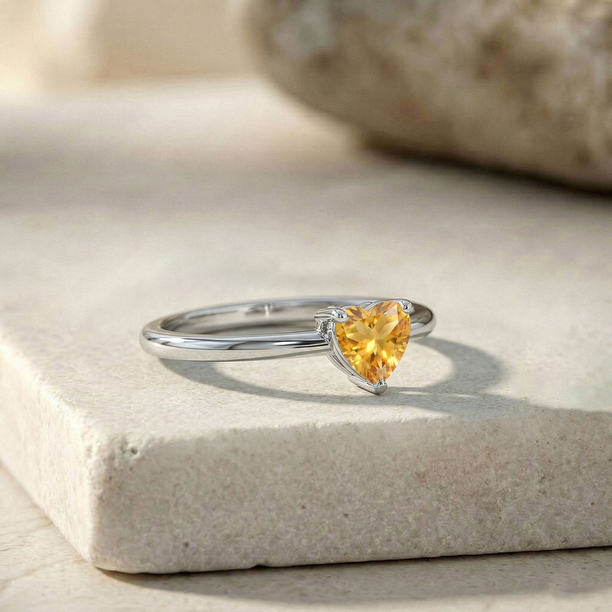 natural gemstone ring, citrine heart jewelry, fine jewelry gift, women's solitaire ring, handcrafted gemstone accessory, sparkling yellow gemstone, elegant jewelry style, birthday present, anniversary jewelry, minimalist fashion, heart cut gemstone, timeless elegance, artisan ring, delicate jewelry, premium craftsmanship