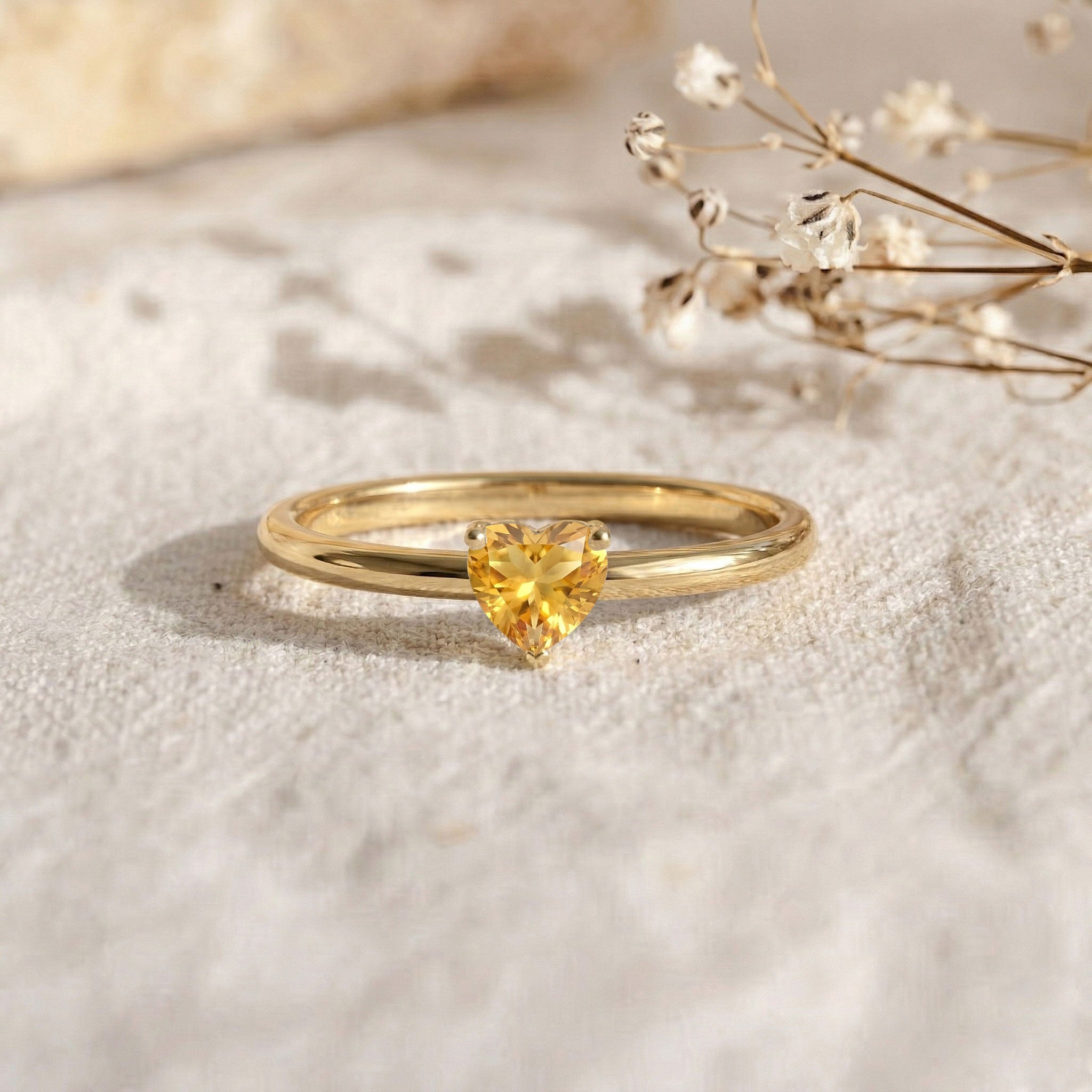 november birthstone ring, natural yellow citrine, heart gemstone jewelry, classic solitaire style, stacking ring, everyday elegance, handmade fine jewelry, women's fashion ring, polished silver jewelry, gift idea, gemstone ring, dainty accessory, heart jewelry, luxury ring, artisan craftsmanship