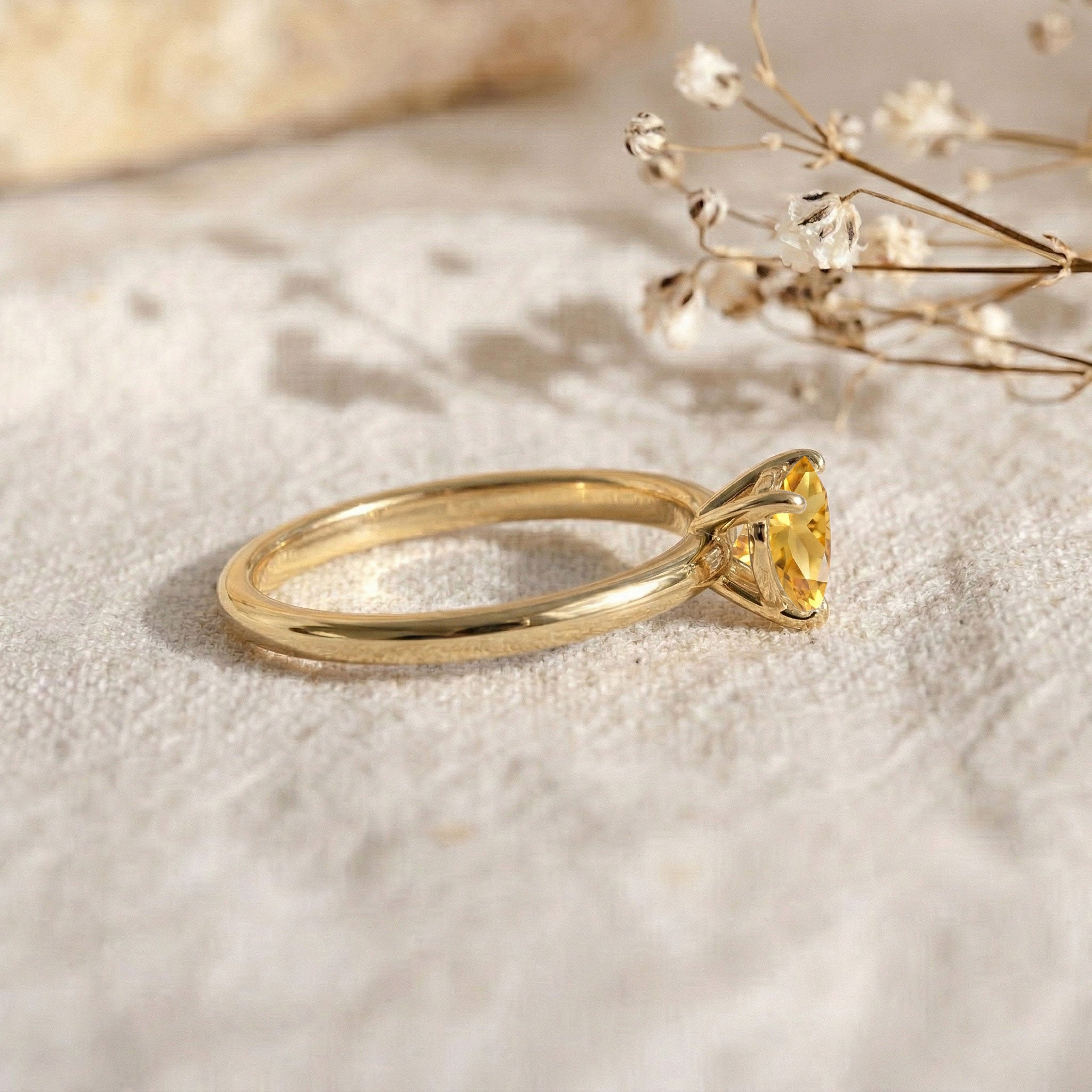 natural citrine heart gemstone, elegant women's ring, handcrafted fine jewelry, solitaire gemstone setting, yellow gemstone accessory, meaningful promise jewelry, anniversary keepsake, birthday ring gift, refined design, artisan jewelry, luxury fashion accessory, timeless heart jewelry, premium gemstone, sophisticated ring, delicate elegance