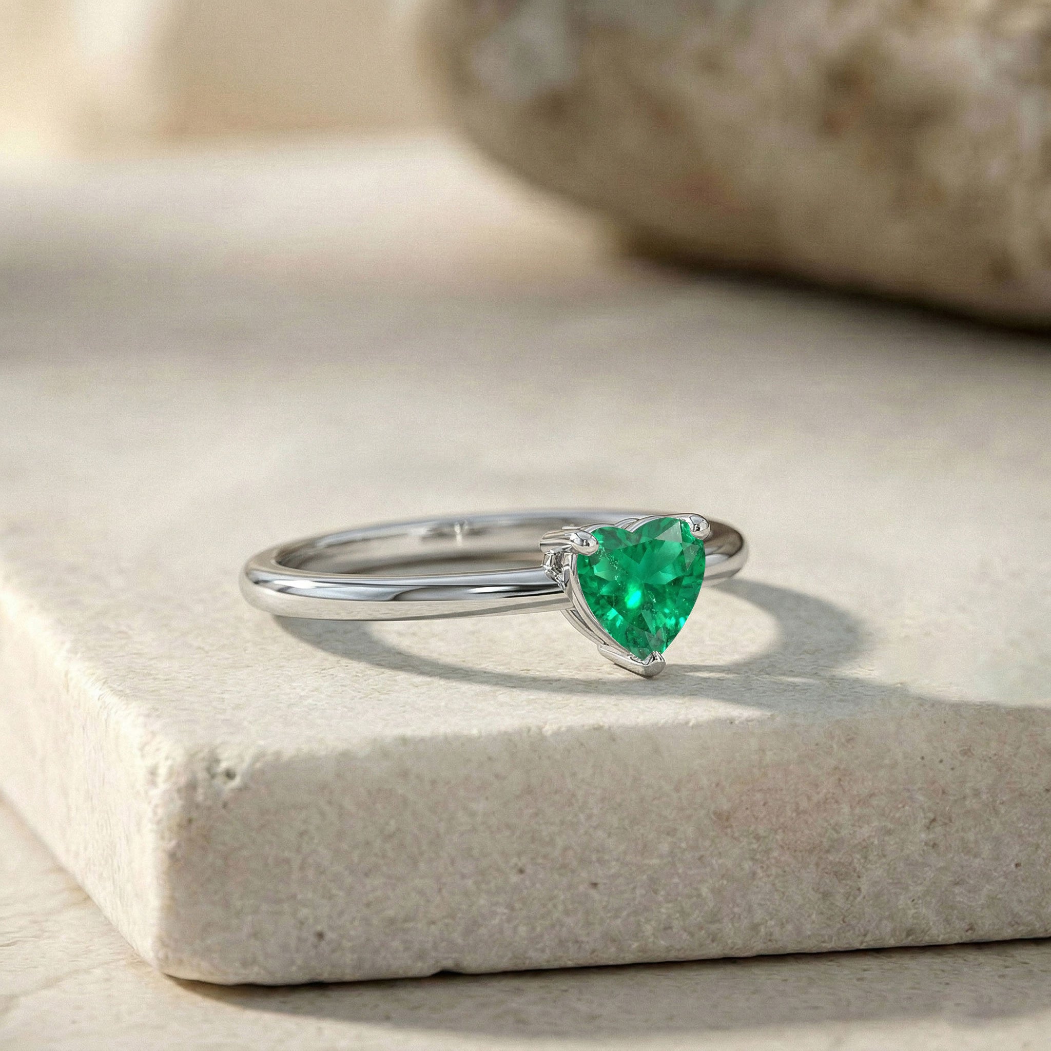 heart solitaire emerald jewelry, classic engagement ring, emerald anniversary gift, green birthstone jewelry, women's fine ring, romantic emerald jewelry, gemstone fashion ring, polished jewelry, timeless promise jewelry, everyday luxury, elegant style, handcrafted accessory, minimalist elegance, refined ring, sparkling emerald