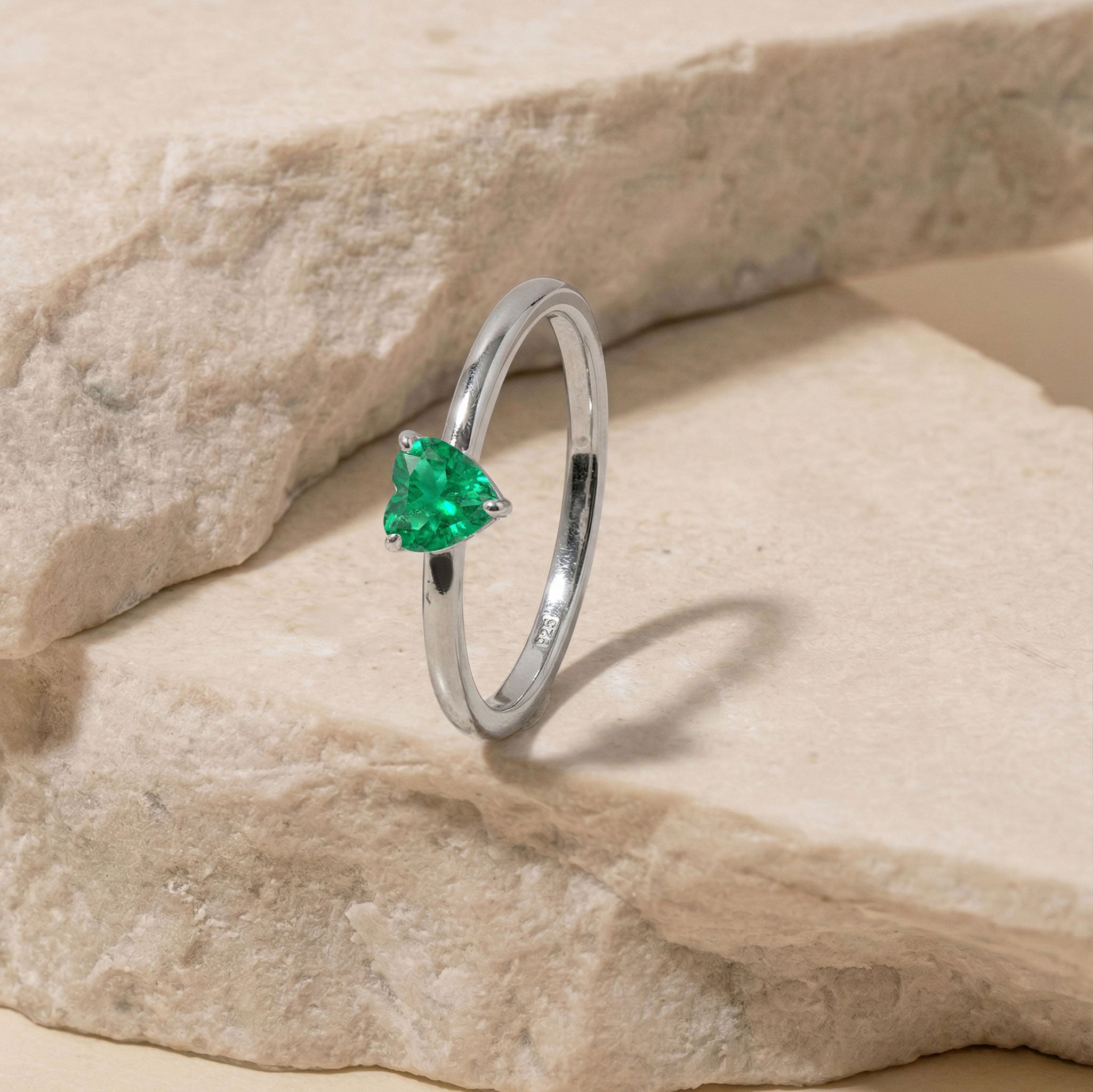 heart emerald promise gift, emerald jewelry for women, solitaire ring style, green gemstone elegance, classic jewelry gift, polished heart ring, romantic emerald accessory, everyday fine jewelry, elegant gemstone design, refined style, birthstone jewelry, women's fashion ring, luxury emerald piece, handcrafted elegance, timeless accessory