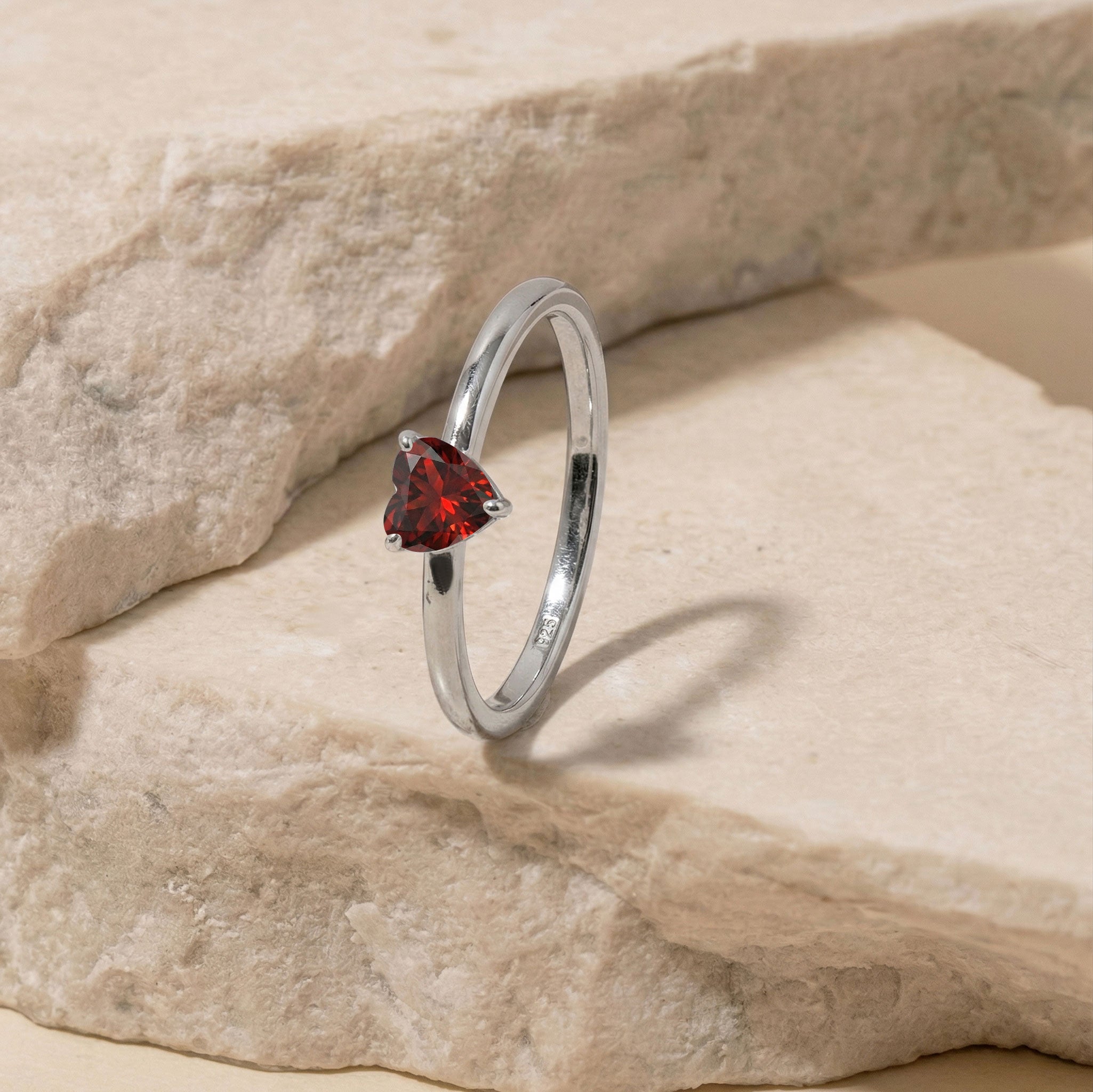 natural garnet fine jewelry, heart cut gemstone accessory, solitaire birthstone ring, polished handcrafted band, elegant romantic ring, january jewelry gift, artisan gemstone design, delicate women's accessory, premium heart jewelry, everyday luxury fashion, timeless handcrafted ring, refined solitaire style, meaningful gemstone jewelry, classic elegance