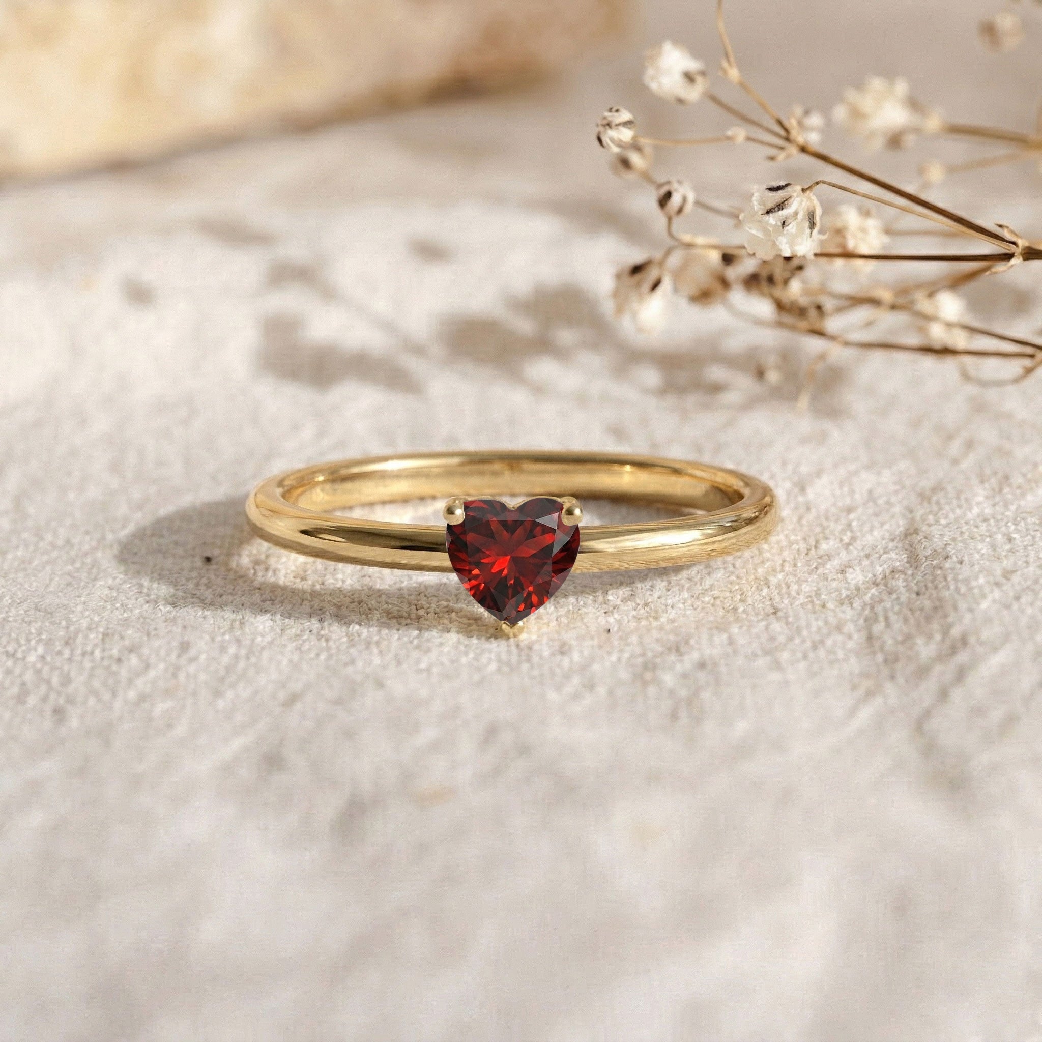 deep red garnet heart jewelry, solitaire gemstone ring, artisan crafted ring, minimalist fashion jewelry, january birthday gift, heart gemstone promise ring, sleek polished shank, refined women's jewelry, natural gemstone accessory, everyday luxury ring, stackable birthstone jewelry, elegant handcrafted ring, dainty gemstone design, romantic gift idea