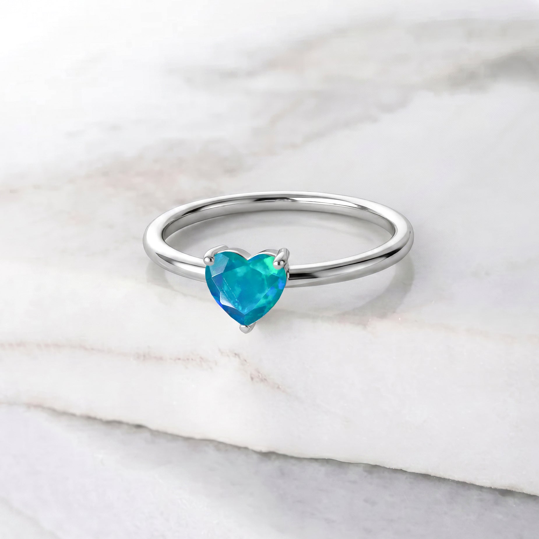 green opal gemstone ring, elegant heart solitaire, classic prong setting, handcrafted jewelry piece, natural gemstone beauty, october birthstone jewelry, romantic heart ring, promise jewelry, fashionable gemstone accessory, timeless ring design, fine jewelry gift, women's everyday ring, refined gemstone style, delicate solitaire, vibrant green gemstone