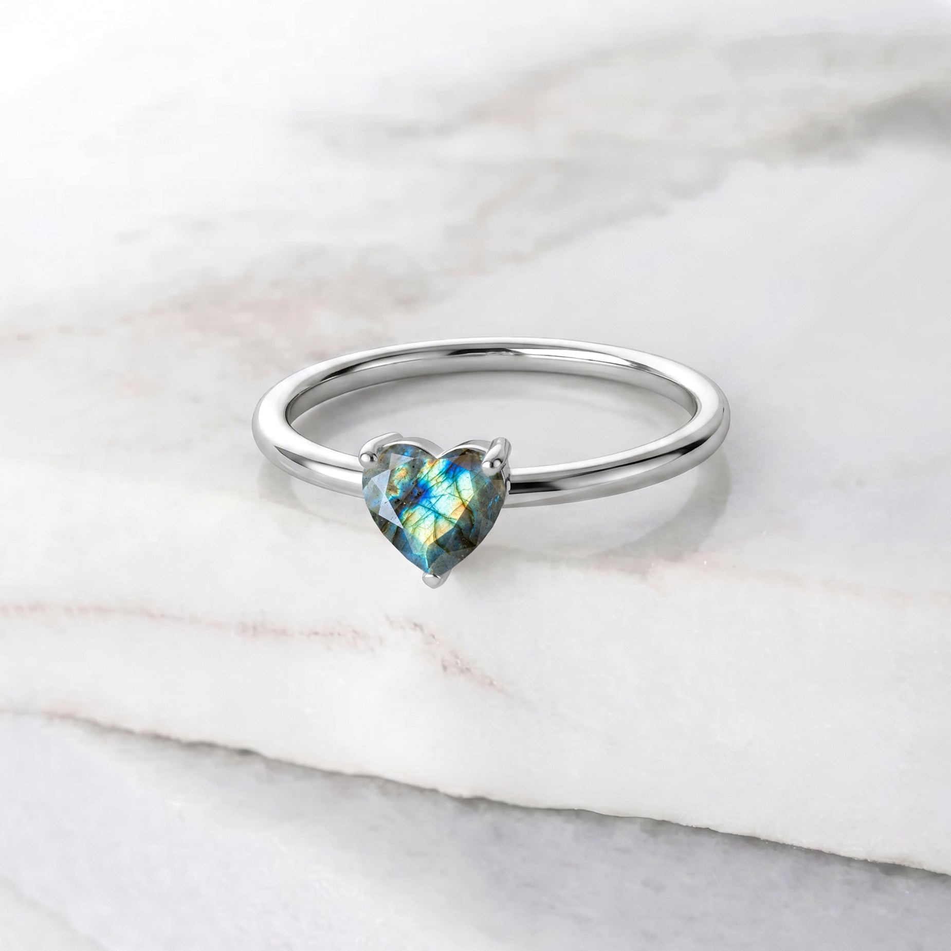 natural labradorite heart jewelry, gemstone solitaire elegance, handcrafted ring artistry, blue green gemstone, polished solitaire ring, meaningful jewelry gift, romantic heart gemstone, artisan craftsmanship, women's fashion jewelry, fine gemstone accessory, classic minimalist ring, timeless design, everyday luxury, gemstone sparkle, elegant styling