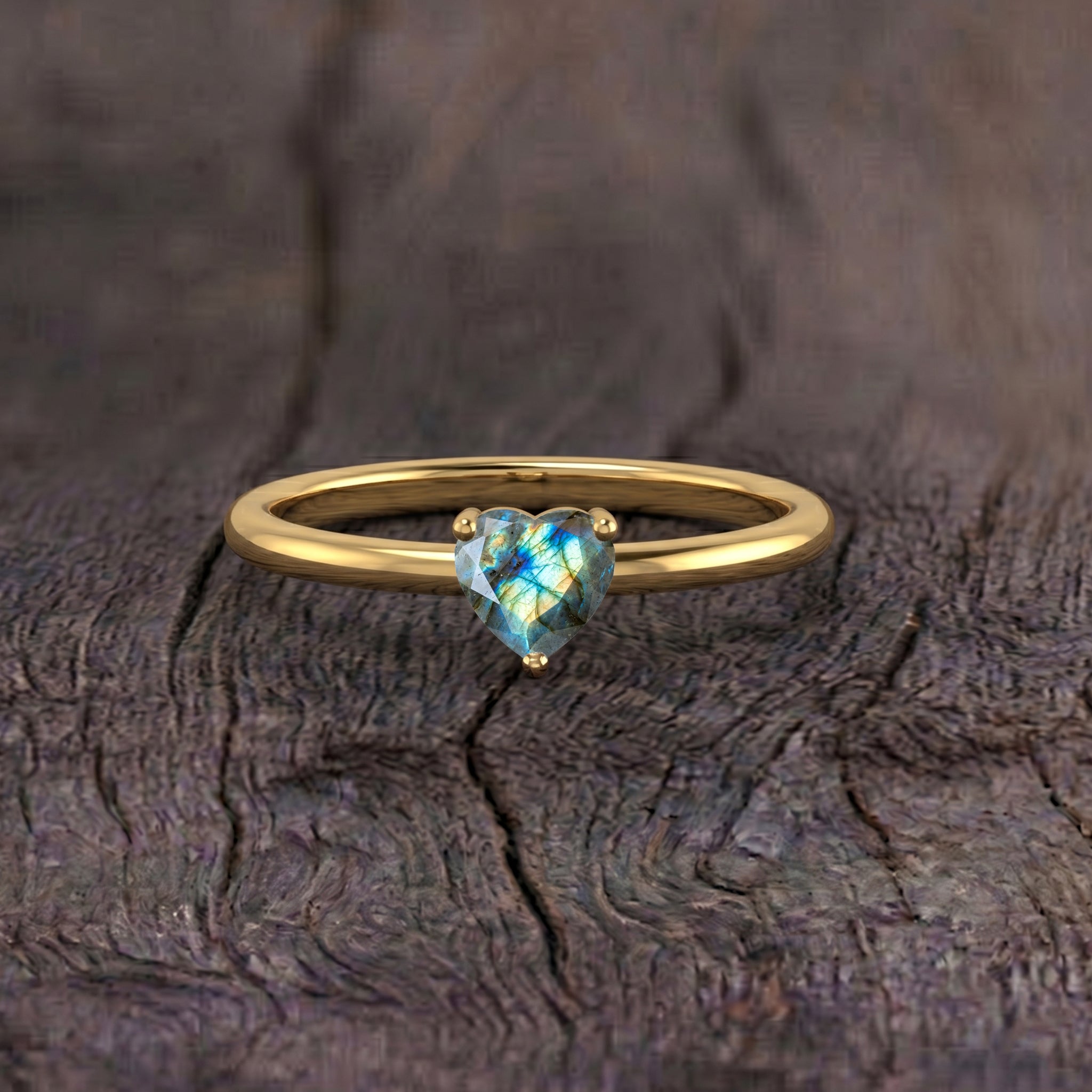 labradorite gemstone close up, heart cut natural stone, solitaire jewelry, shimmering labradorescence, elegant gemstone accessory, handcrafted jewelry design, women's gemstone ring, unique natural gemstone, classic heart solitaire, premium jewelry craftsmanship, romantic jewelry, refined gemstone ring, timeless elegance, polished finish, fine jewelry