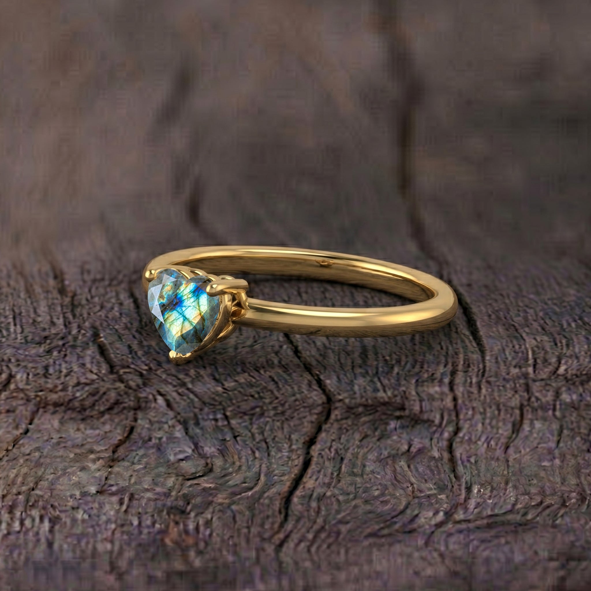 heart cut labradorite ring, natural gemstone brilliance, solitaire fashion jewelry, blue flash gemstone ring, handcrafted elegant jewelry, timeless women's accessory, refined gemstone craftsmanship, promise ring inspiration, sophisticated jewelry design, premium gemstone sparkle, everyday minimalist jewelry, romantic gift idea, artisan ring, natural stone, feminine elegance
