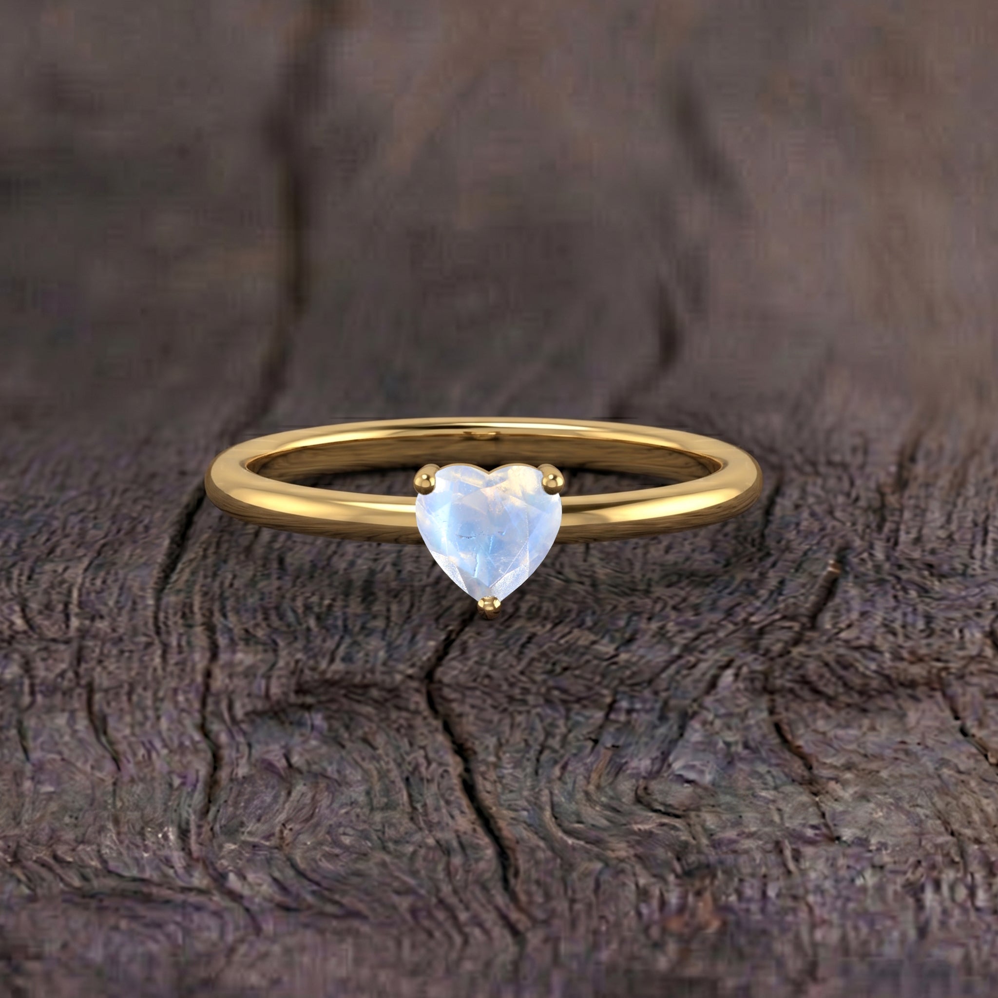 heart shaped moonstone, solitaire gemstone jewelry, natural gemstone ring, elegant handcrafted accessory, women's fine jewelry, refined ring design, meaningful gemstone gift, birthday present, anniversary keepsake, romantic jewelry, timeless elegance, artisan craftsmanship, gemstone centerpiece, minimalist jewelry, polished finish