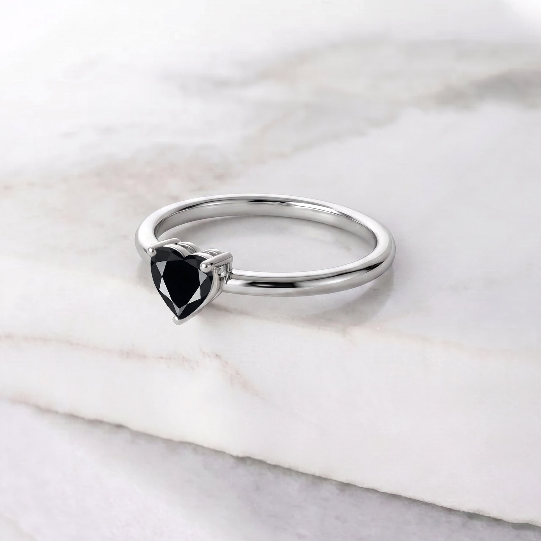 natural heart cut black onyx, solitaire gemstone jewelry, black gemstone fashion ring, elegant promise jewelry, handcrafted women's ring, anniversary present, minimalist heart jewelry, gemstone gift for women, artisan jewelry design, classic solitaire ring, black stone jewelry, romantic accessory, everyday luxury jewelry, fine jewelry collection, heart gemstone ring