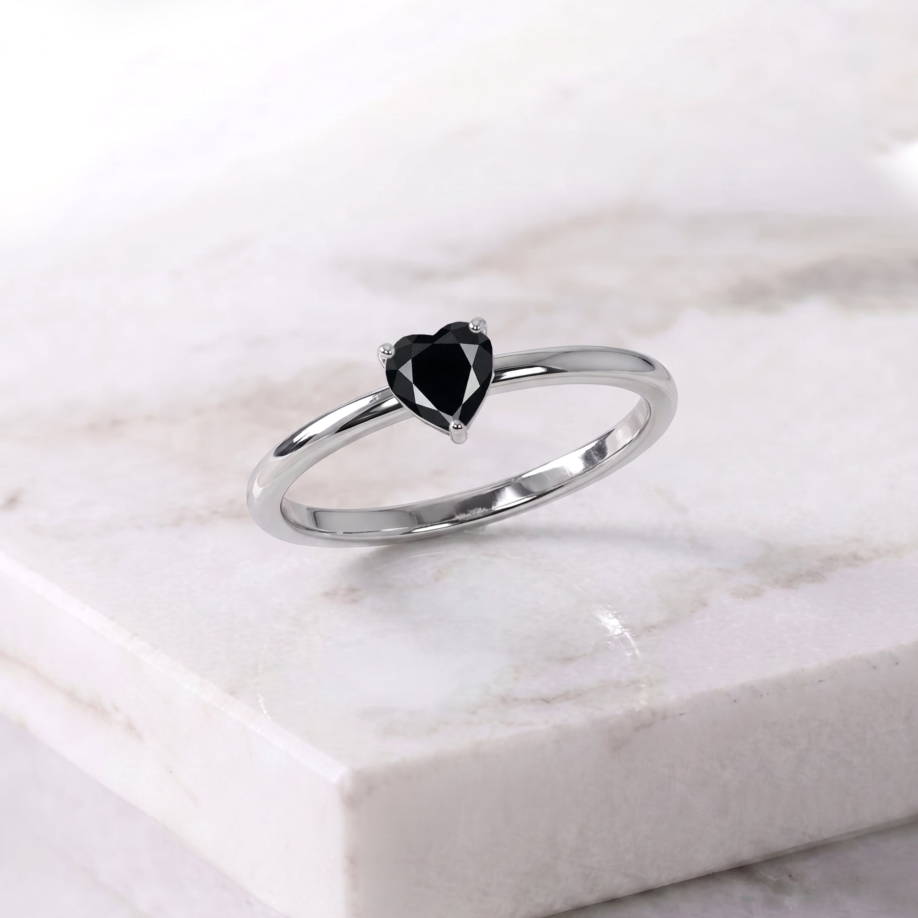 natural black onyx jewelry, heart shaped gemstone accessory, elegant solitaire ring, handcrafted artisan jewelry, black gemstone gift for women, promise jewelry ring, luxury minimalist accessory, fine jewelry design, anniversary ring gift, classic gemstone style, timeless heart jewelry, sophisticated accessory, polished gemstone, women's fashion ring, romantic jewelry