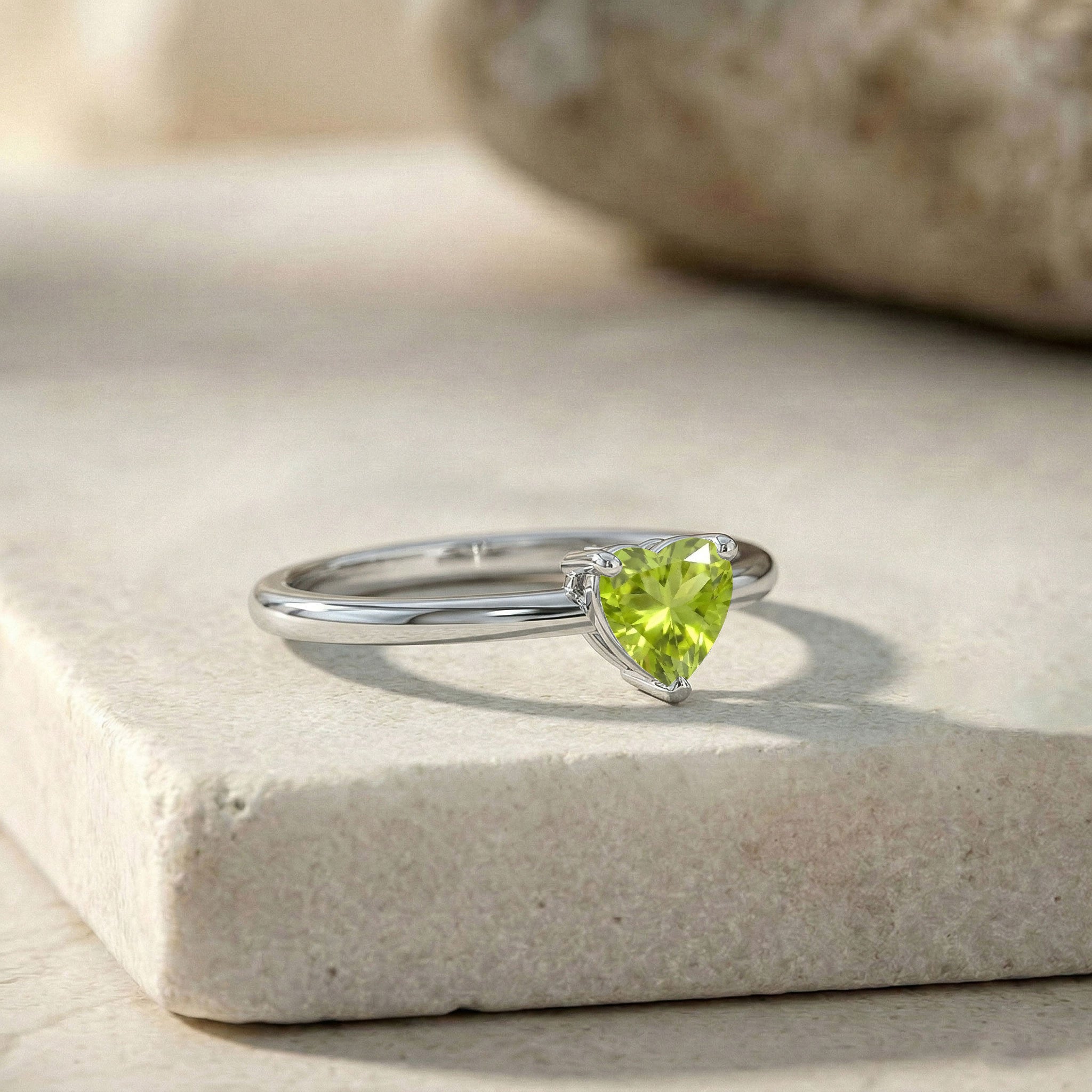 natural heart peridot ring, polished sterling silver jewelry, green birthstone ring, solitaire gemstone jewelry, heart gemstone accessory, elegant stacking ring, anniversary gift jewelry, promise ring women, minimalist fine jewelry, handcrafted ring design, classic style ring