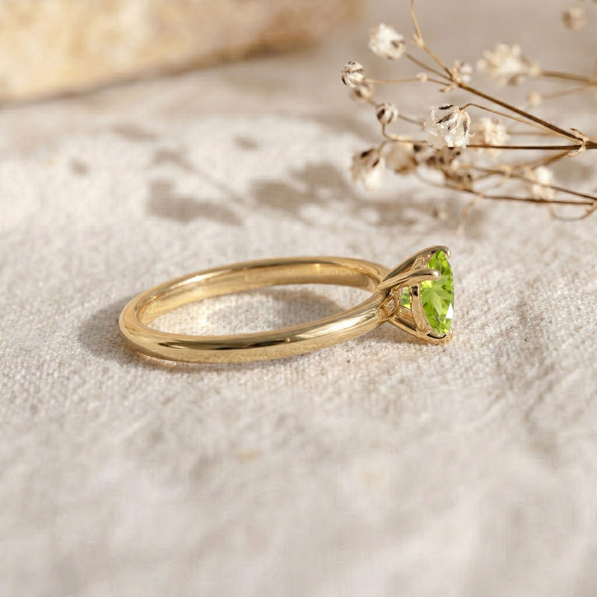 natural peridot jewelry ring, heart cut gemstone design, solitaire fine jewelry, elegant women's accessory, polished comfort fit ring, vibrant green gemstone, august jewelry gift, delicate stacking ring, classic heart setting, everyday elegance, gemstone promise jewelry