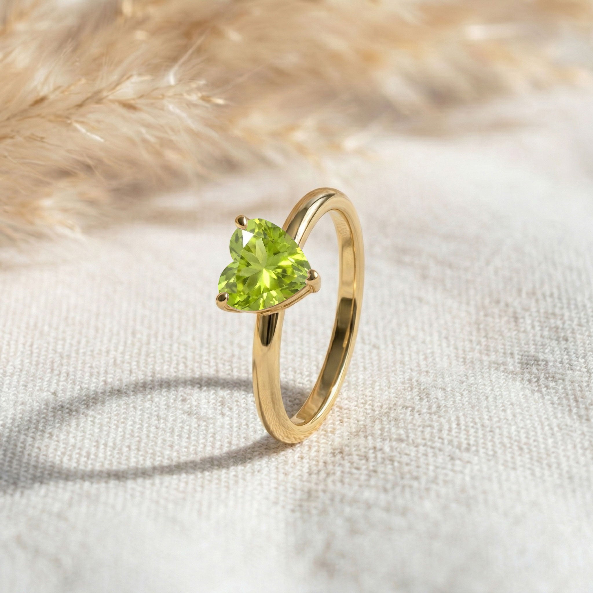 heart gemstone solitaire jewelry, natural peridot fashion ring, vibrant green birthstone, classic women jewelry, elegant promise ring, fine jewelry design, polished comfort band, heart gemstone accessory, timeless minimalist style, gift for her jewelry, refined elegance