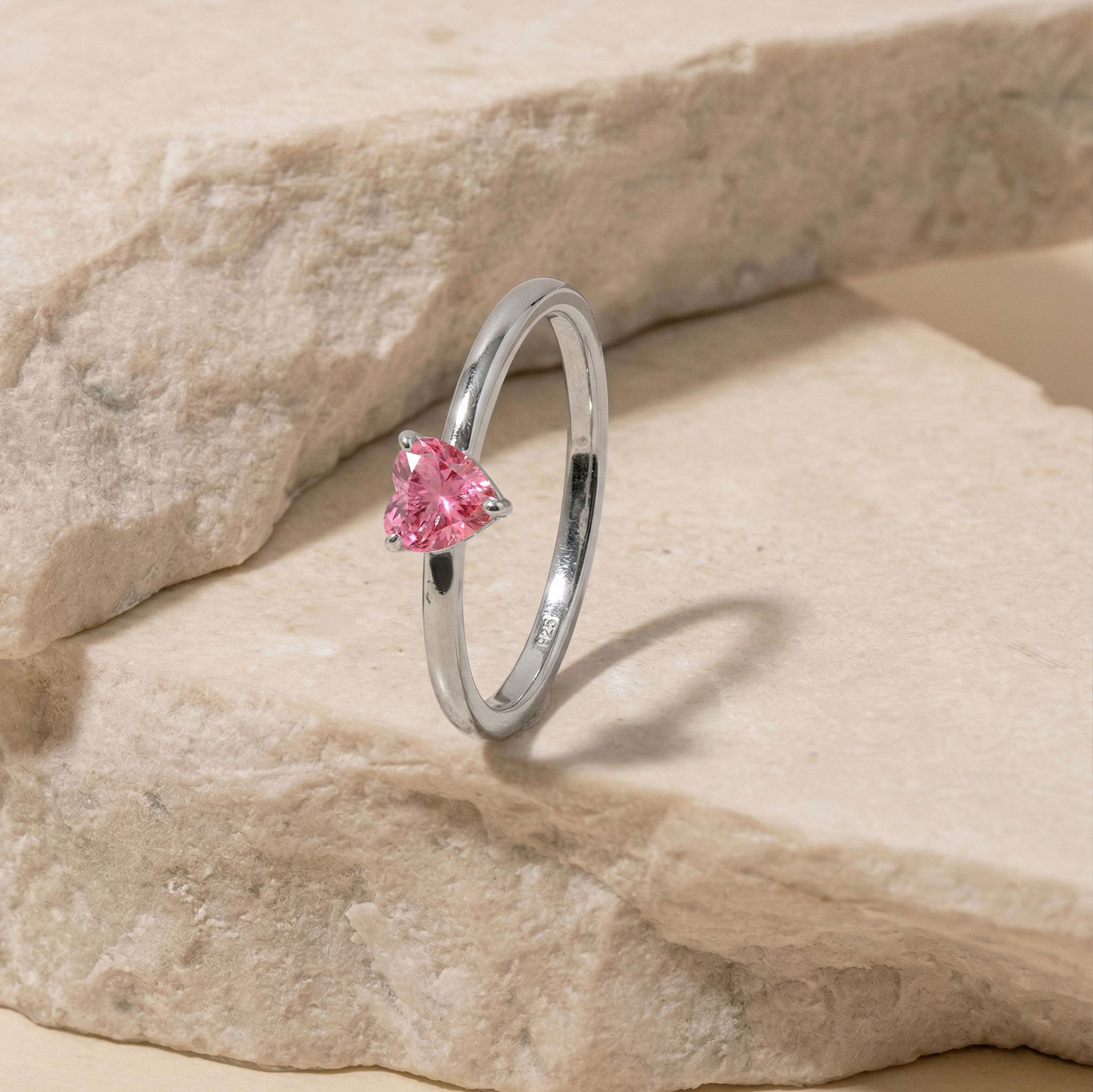 pink gemstone fashion ring, handcrafted heart jewelry, polished sterling silver band, gold filled gemstone ring, artisan ring design, elegant women's ring, minimalist promise jewelry, romantic fashion accessory, luxury jewelry piece, fine handcrafted accessory, anniversary keepsake, timeless elegance, gemstone jewelry collection, classic style, handmade ring