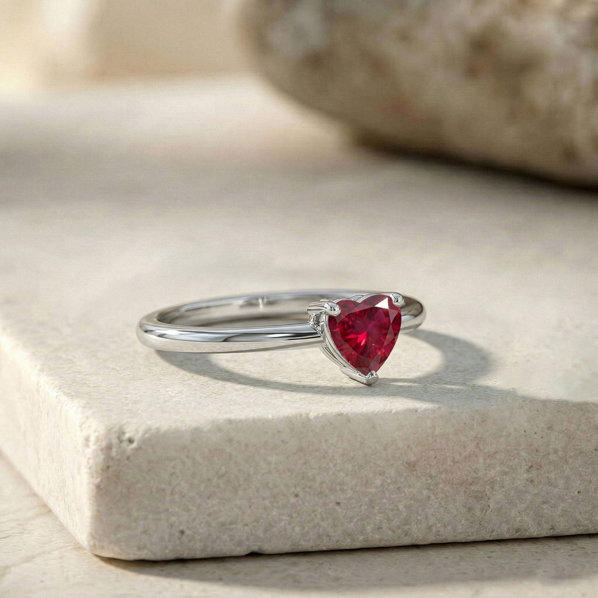 natural red ruby ring, heart cut gemstone jewelry, july birthstone gift, elegant solitaire jewelry, fine ruby accessory, minimalist women's ring, polished metal finish, anniversary jewelry, handcrafted ruby ring, classic gemstone fashion