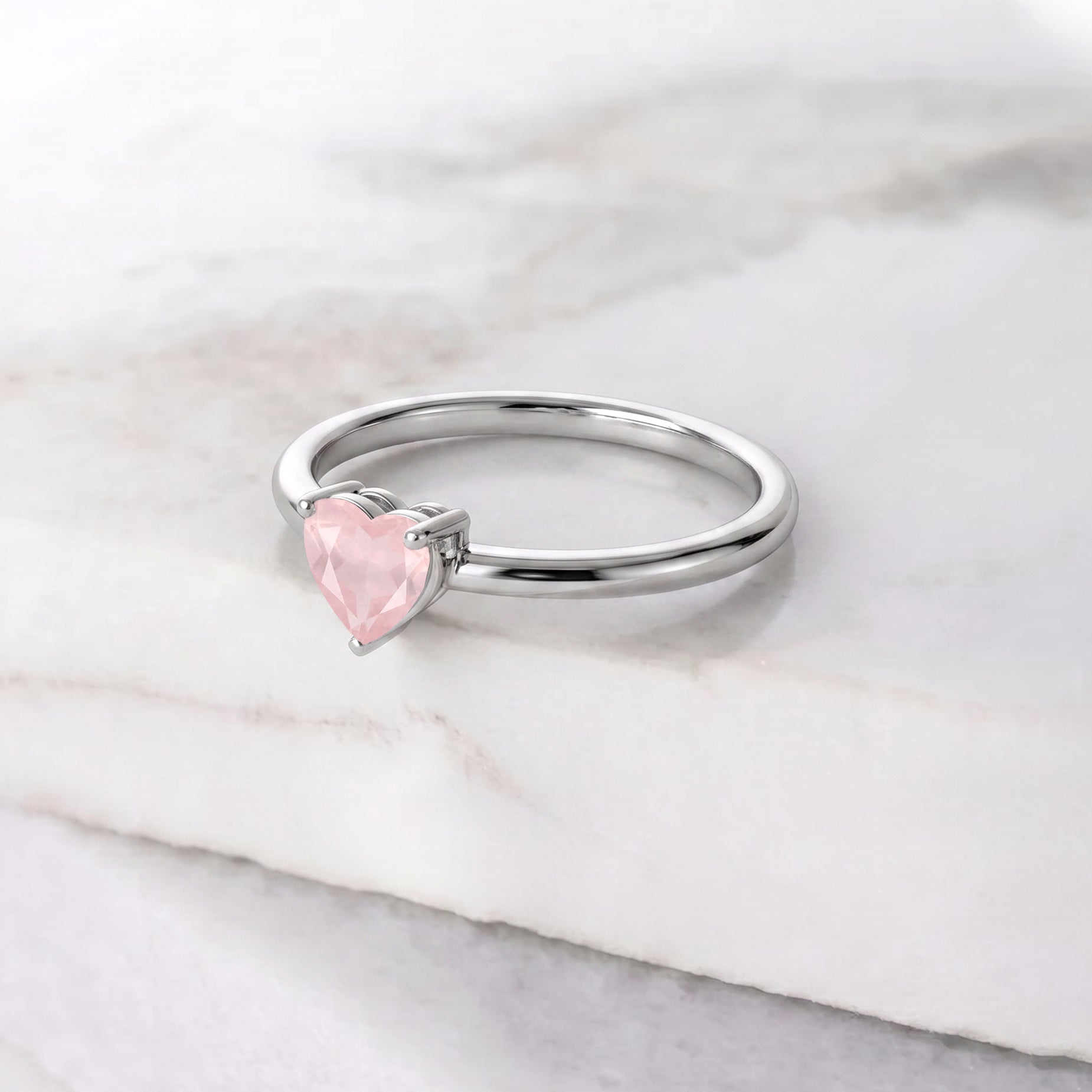 natural rose quartz fine jewelry, heart shaped gemstone accessory, elegant handcrafted ring, solitaire gemstone jewelry, romantic jewelry collection, women's gemstone gift, minimalist artisan jewelry, promise jewelry, everyday fashion ring, polished gemstone jewelry, timeless elegance, handcrafted jewelry, luxury gemstone ring, birthday jewelry, classic jewelry