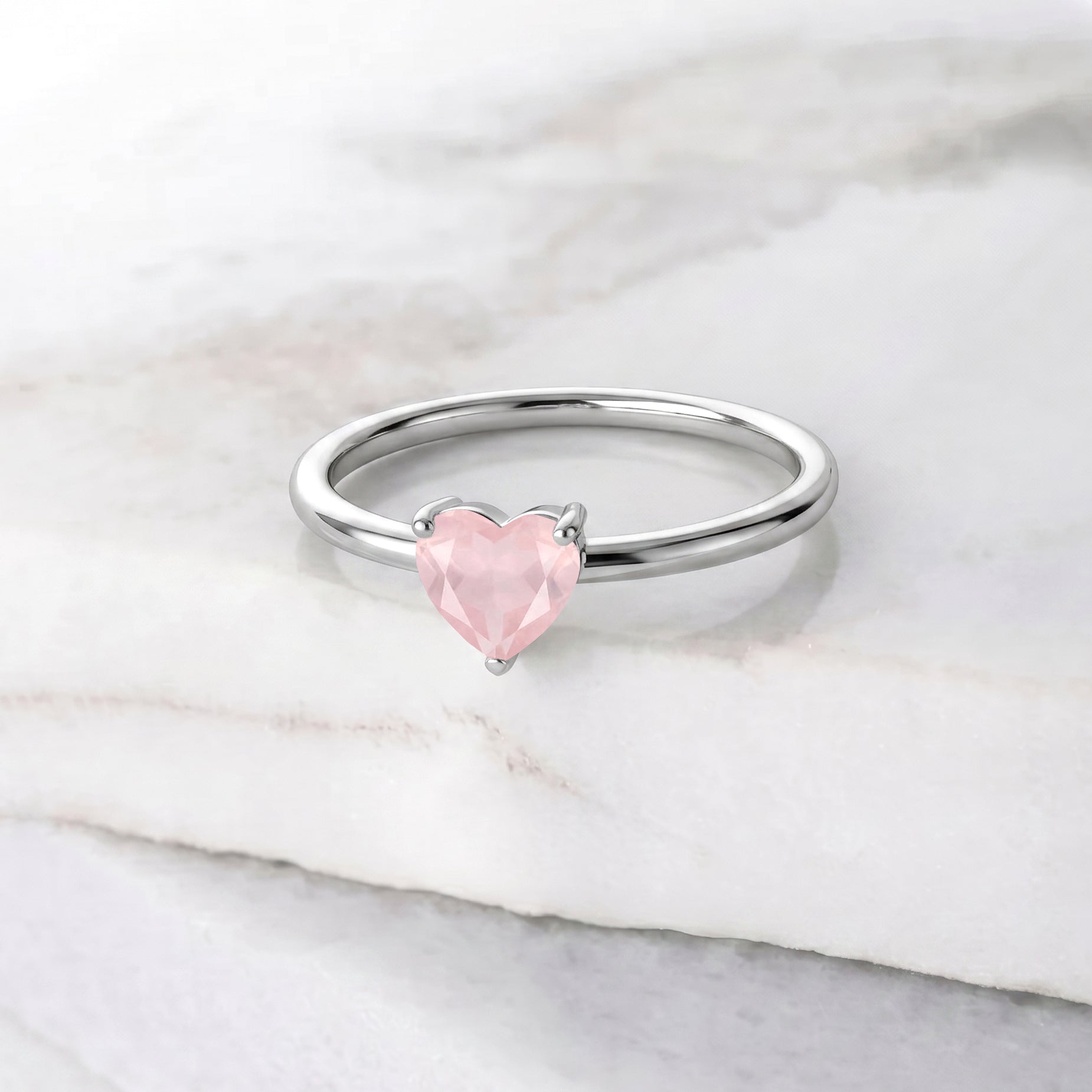 natural rose quartz solitaire jewelry, heart gemstone accessory, elegant women's ring, handcrafted gemstone gift, romantic jewelry for her, polished pink gemstone, fine artisan jewelry, anniversary jewelry, promise ring style, minimalist heart jewelry, luxury gemstone accessory, timeless fine jewelry, delicate gemstone ring, birthday gift, handcrafted design