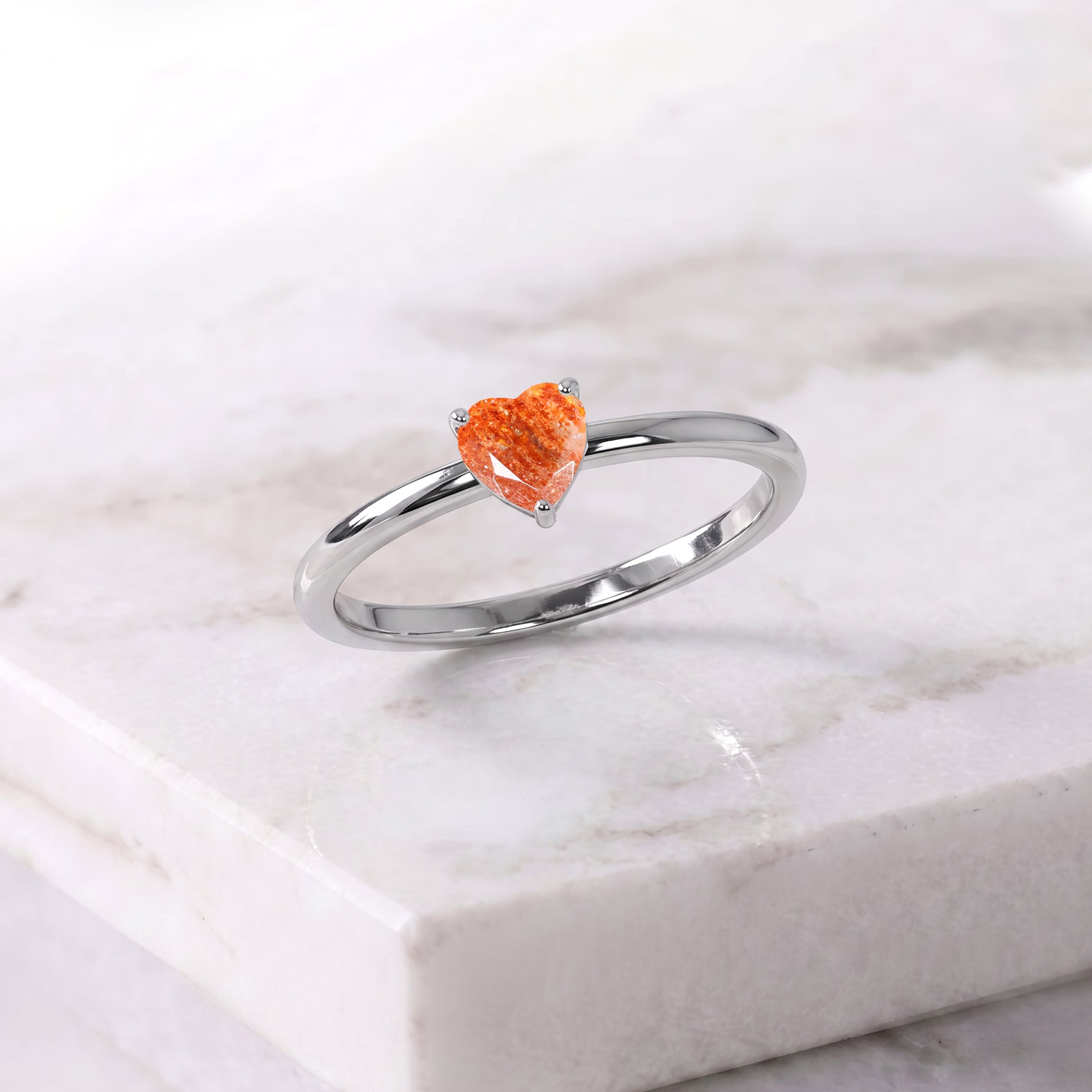 natural gemstone heart ring, sunstone jewelry accessory, elegant handcrafted design, women's fine jewelry, artisan gemstone ring, premium jewelry collection, timeless craftsmanship, anniversary present, birthday accessory, refined jewelry, polished gemstone, luxury style, romantic jewelry, fashionable ring, gemstone lover
