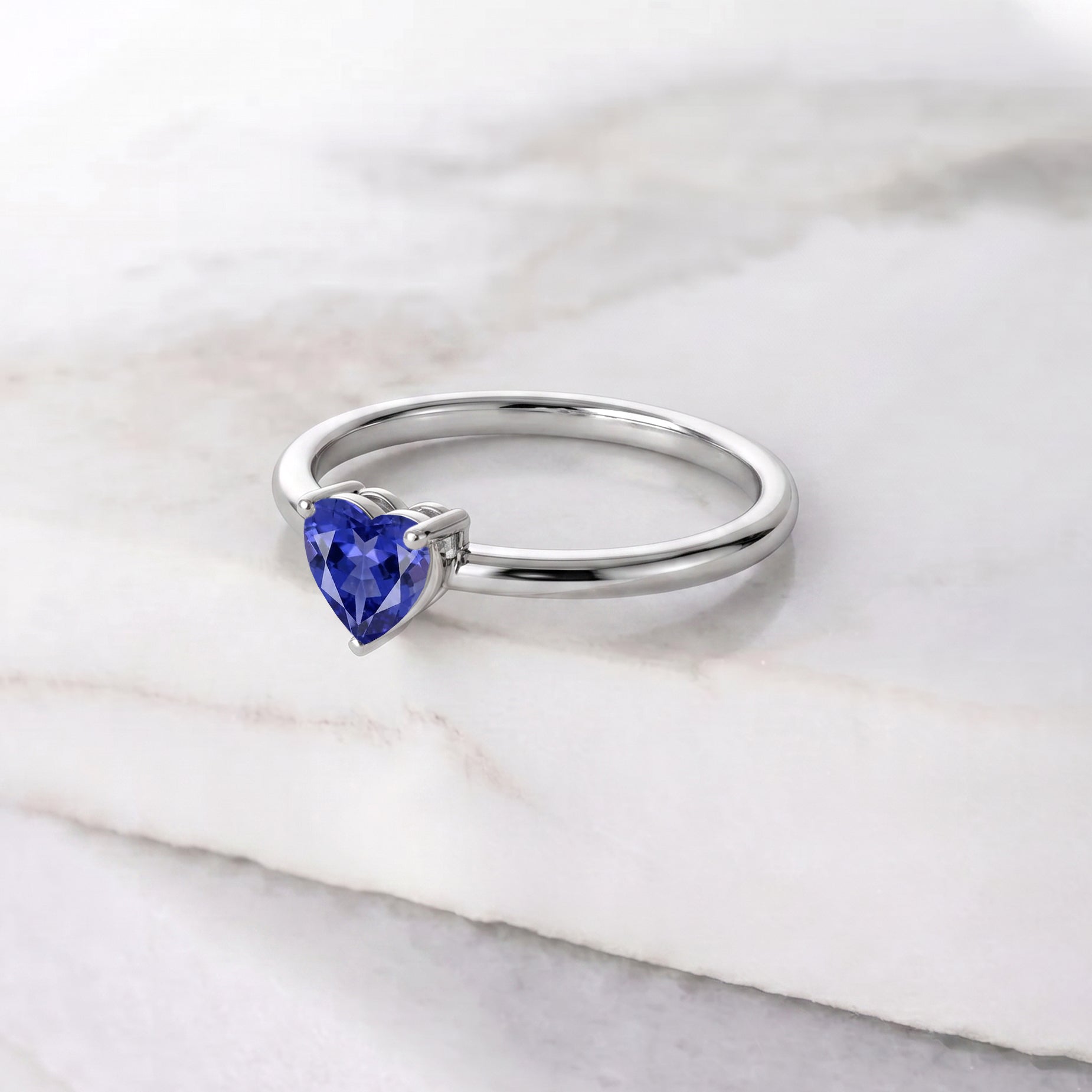 heart solitaire tanzanite, gemstone jewelry for women, handcrafted elegant ring, artisan craftsmanship, polished gemstone accessory, classic jewelry gift, promise ring design, anniversary keepsake, december gemstone jewelry, birthday jewelry, refined elegance, timeless fashion, premium quality, romantic ring, everyday accessory