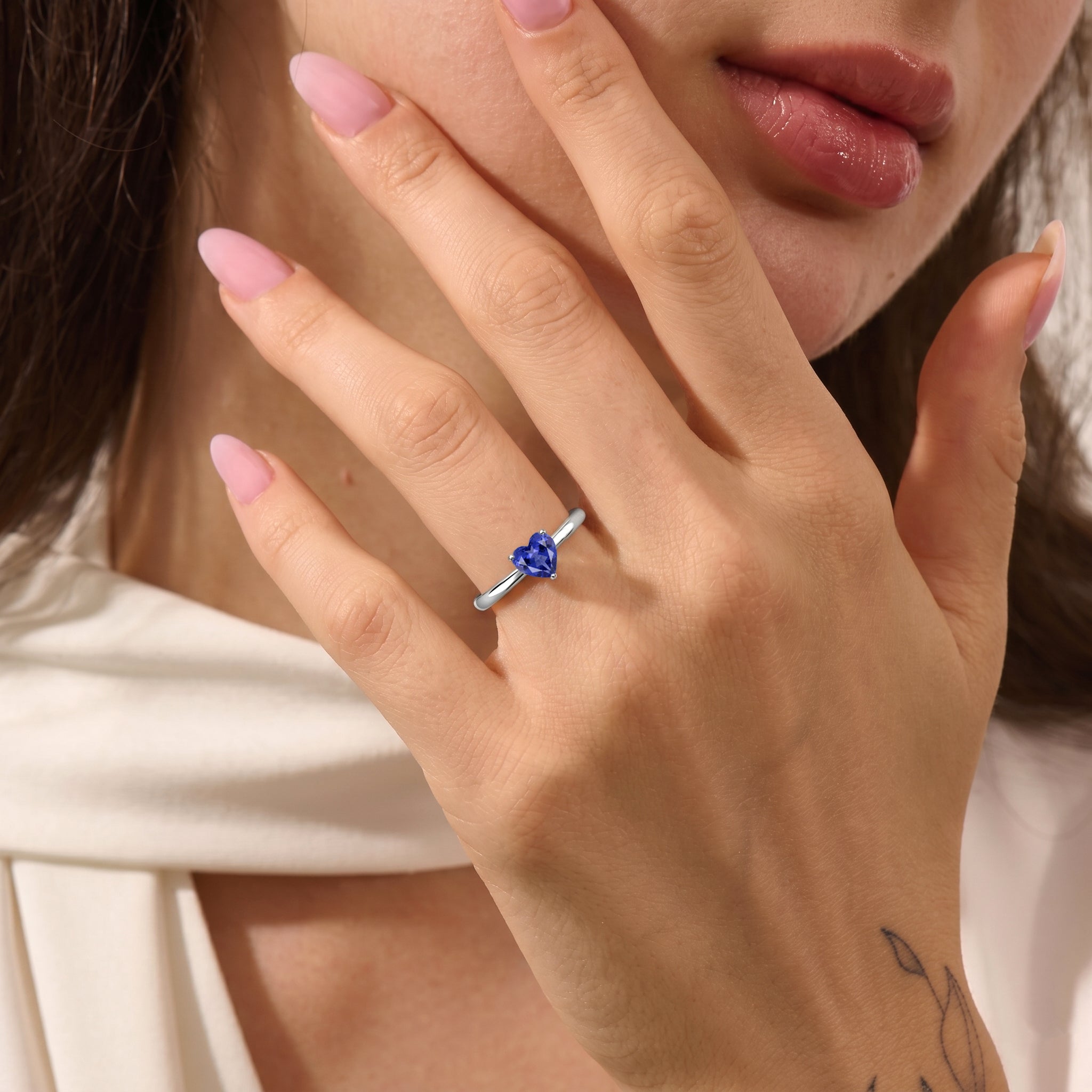 tanzanite gemstone jewelry, heart shaped ring, handcrafted artisan accessory, classic solitaire elegance, women's gemstone jewelry, meaningful gift, promise jewelry, anniversary keepsake, birthday inspiration, timeless ring style, polished finish, elegant fashion accessory, premium craftsmanship, gemstone collection, romantic design