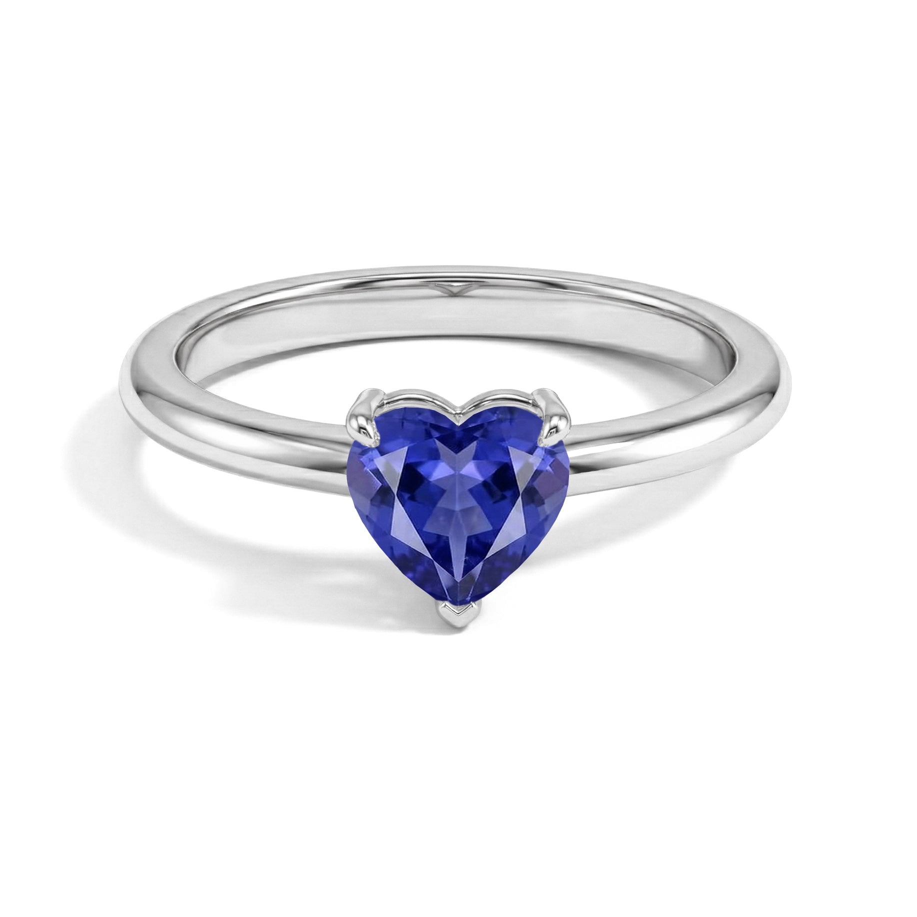 tanzanite heart ring, heart cut tanzanite jewelry, lab tanzanite gemstone, solitaire gemstone ring, elegant women's jewelry, handcrafted ring, december birthstone jewelry, promise ring, romantic gift, fine jewelry, timeless solitaire design, gemstone accessory, everyday jewelry, heart gemstone, minimalist style