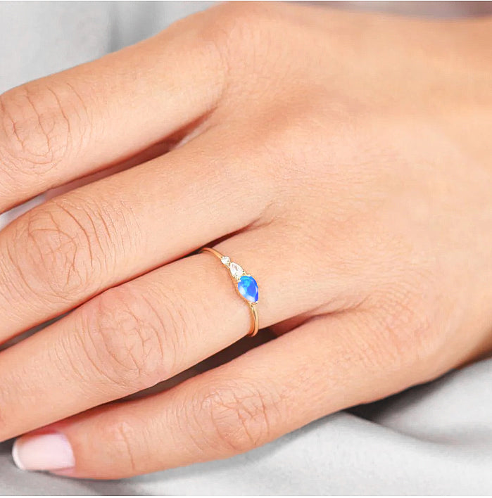 Blue Fire Opal Pear Three Stone Ring