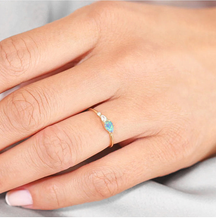 White Fire Opal Pear Three Stone Ring