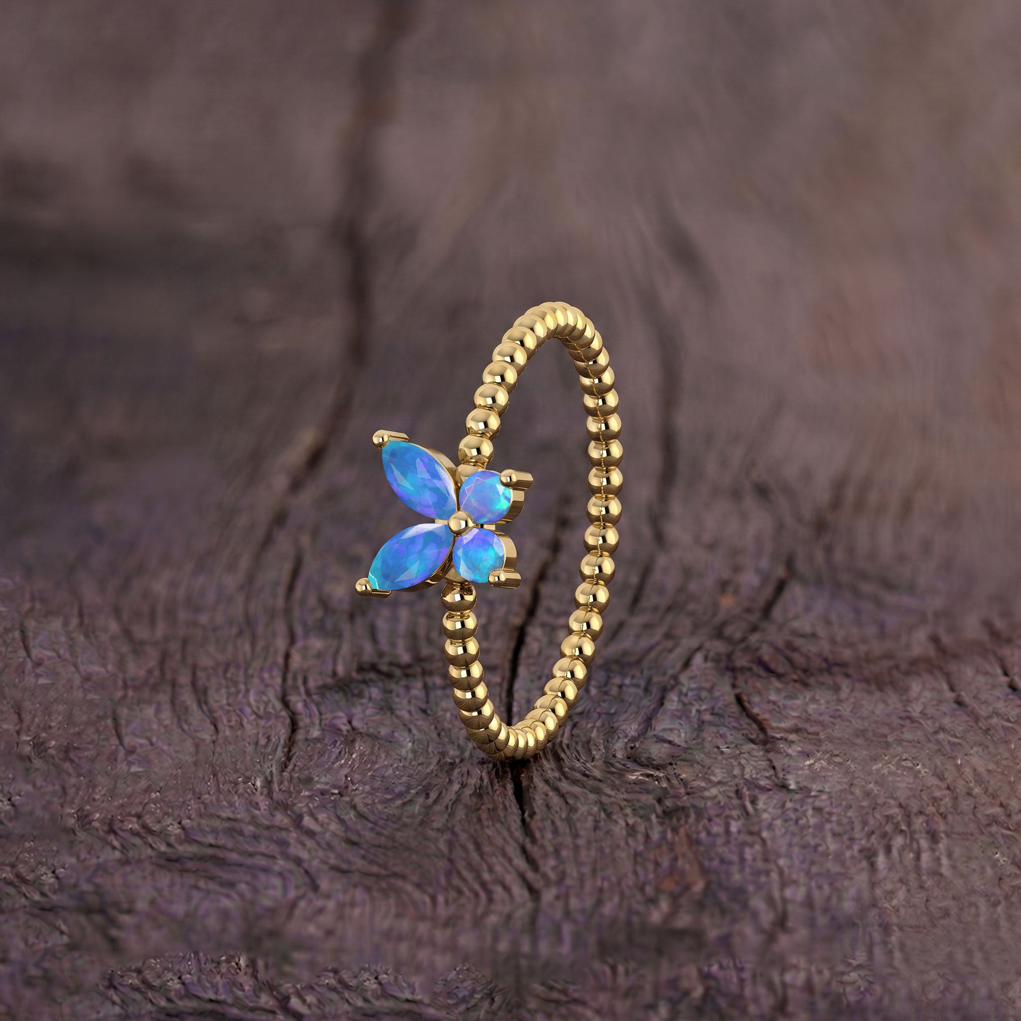 Natural blue opal statement ring for women with a graceful butterfly silhouette, luminous marquise gemstones, round opal accents, and sterling silver craftsmanship