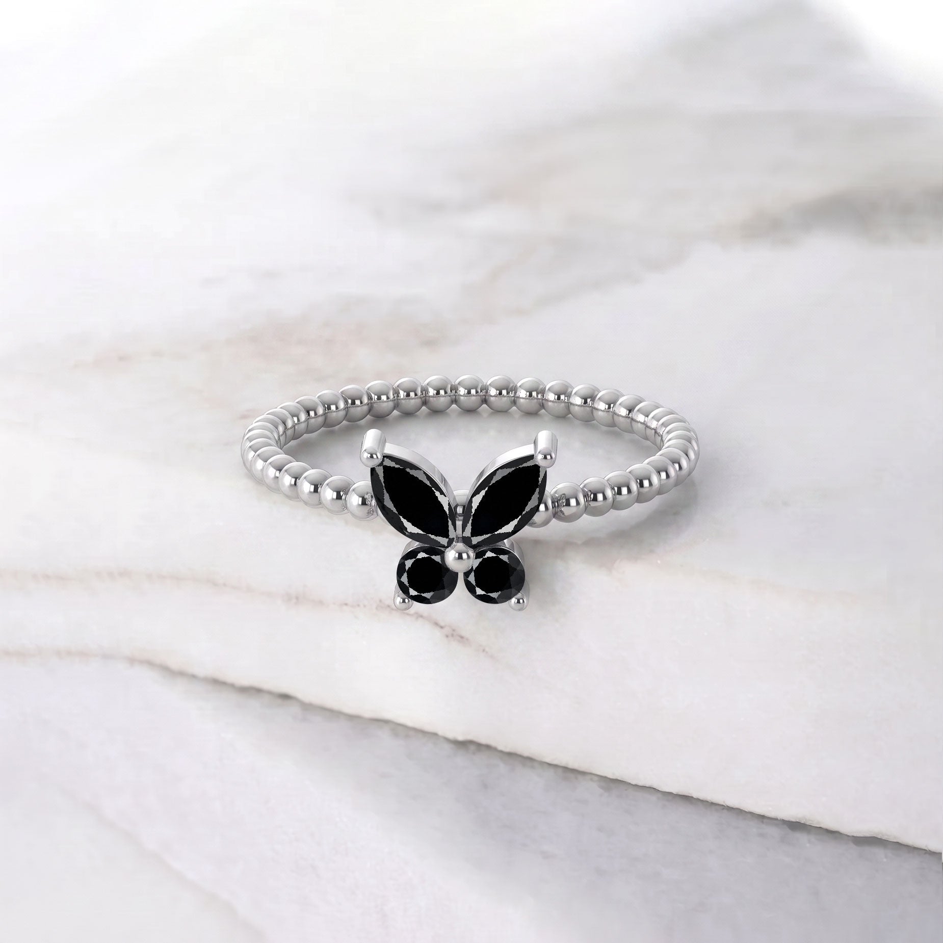 Unique black onyx butterfly statement ring featuring an elegant marquise gemstone centerpiece and refined butterfly detailing, distinctive jewelry for women