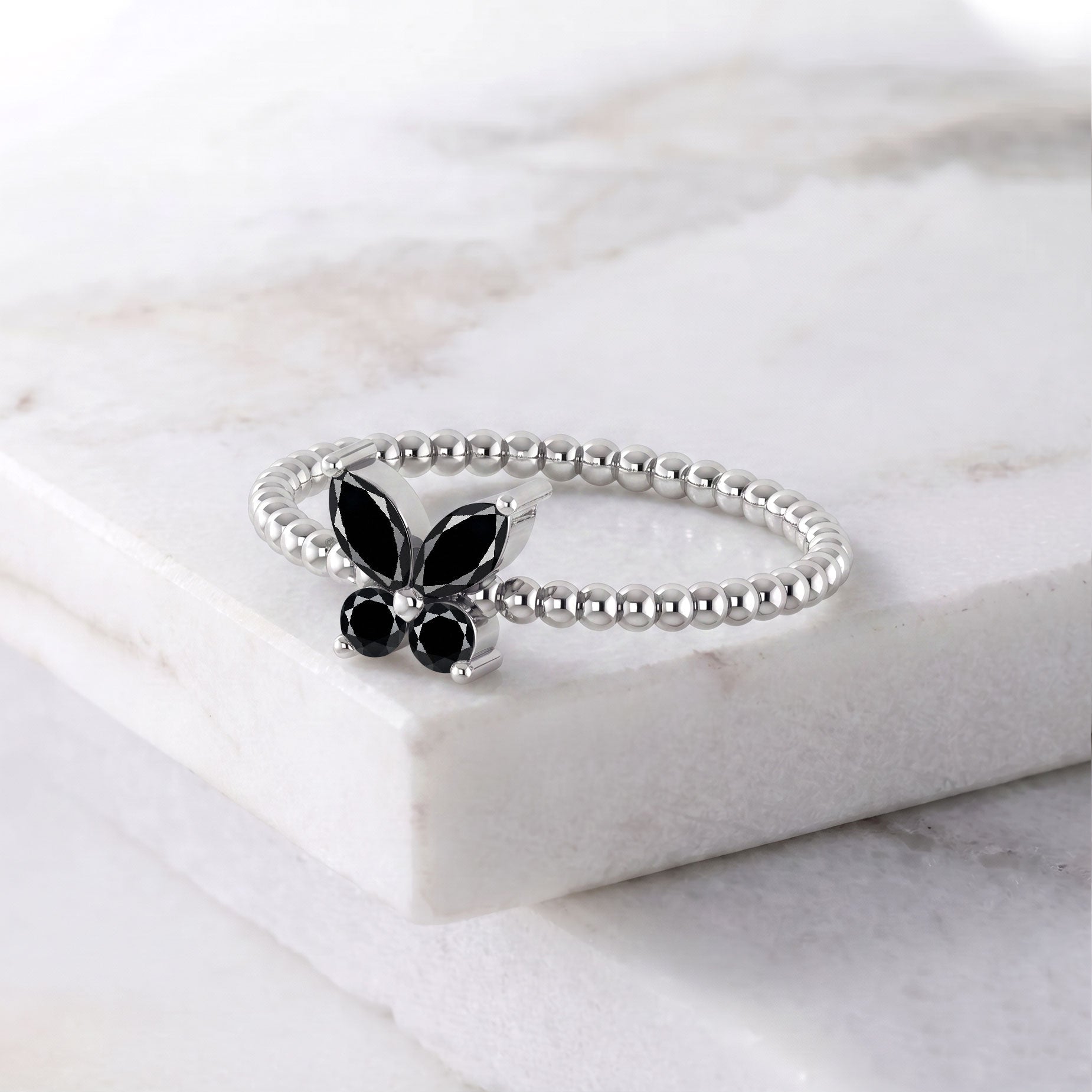 Black gemstone butterfly ring featuring a graceful sculptural design and elegant dark onyx centerpiece, sophisticated statement jewelry for women and special occasions