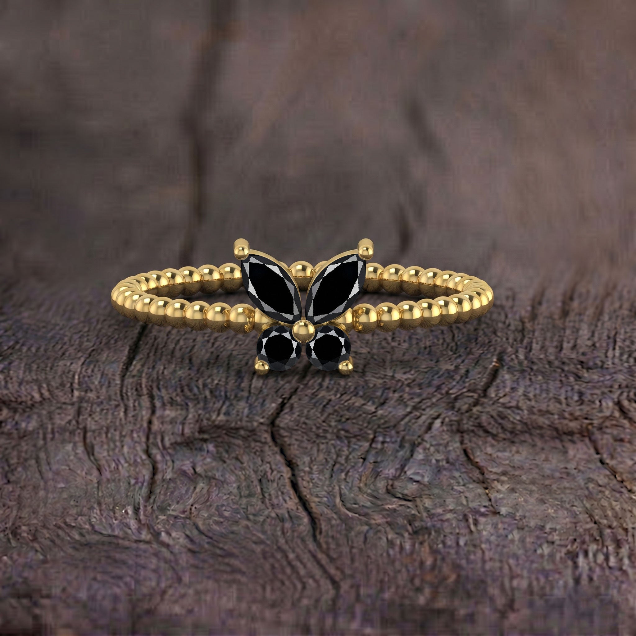 Elegant black onyx gemstone butterfly ring with a distinctive sculptural design, refined statement jewelry for women in 925 sterling silver or yellow gold filled