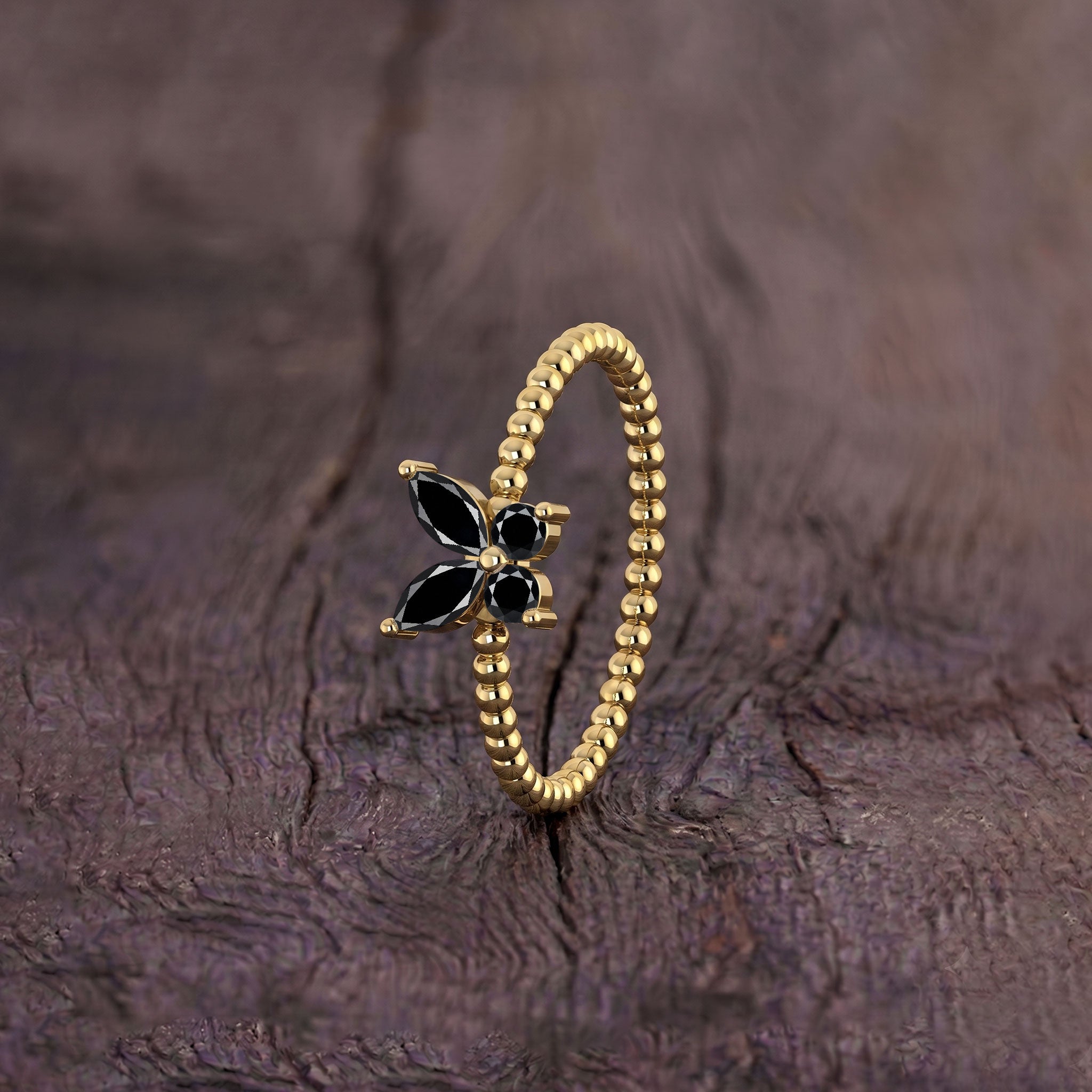 Unique black onyx gemstone ring featuring an elegant butterfly silhouette and refined detailing, distinctive statement jewelry designed for women who love artistic pieces