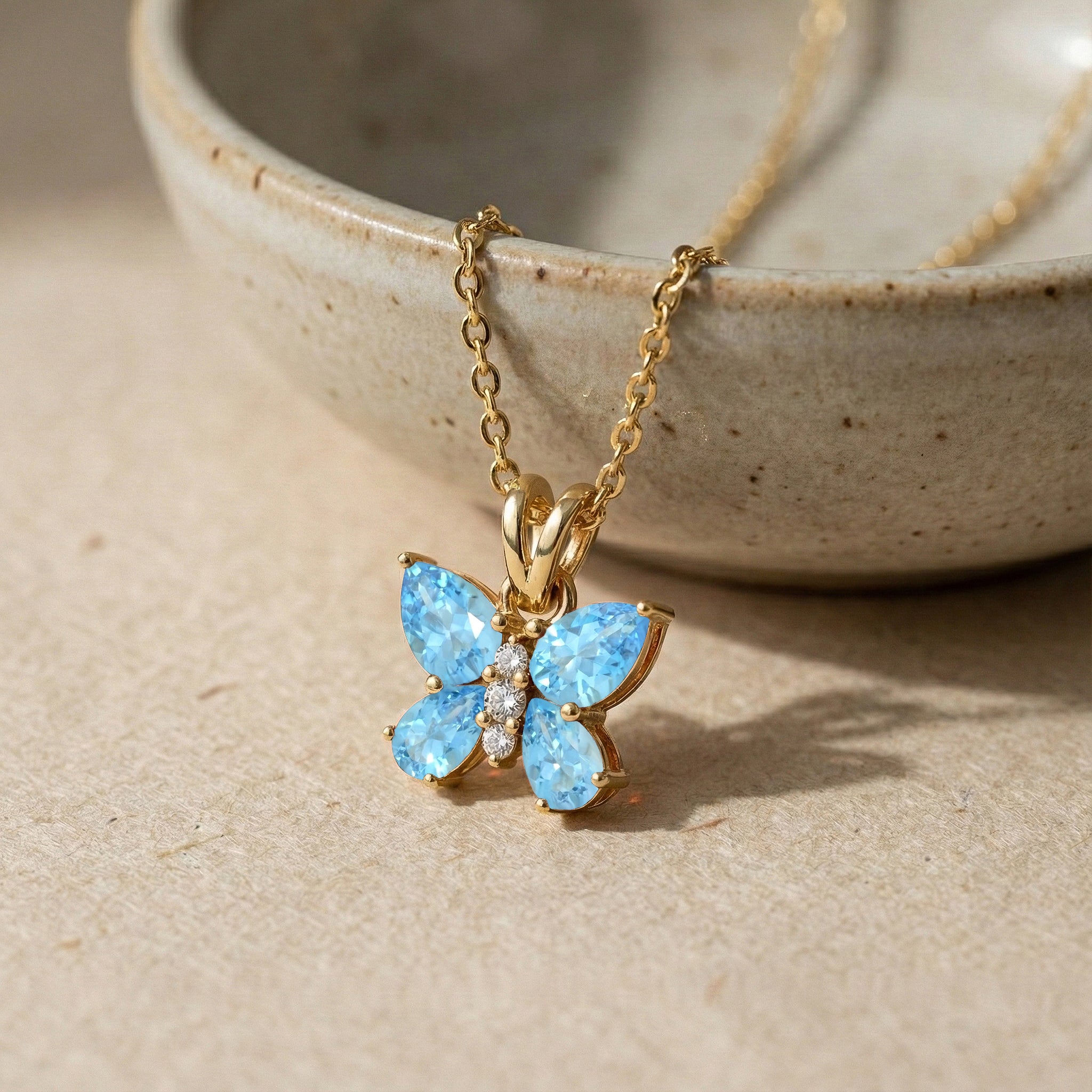 Blue Topaz Pear Butterfly Pendant Necklace in Yellow Gold Plated 2ct