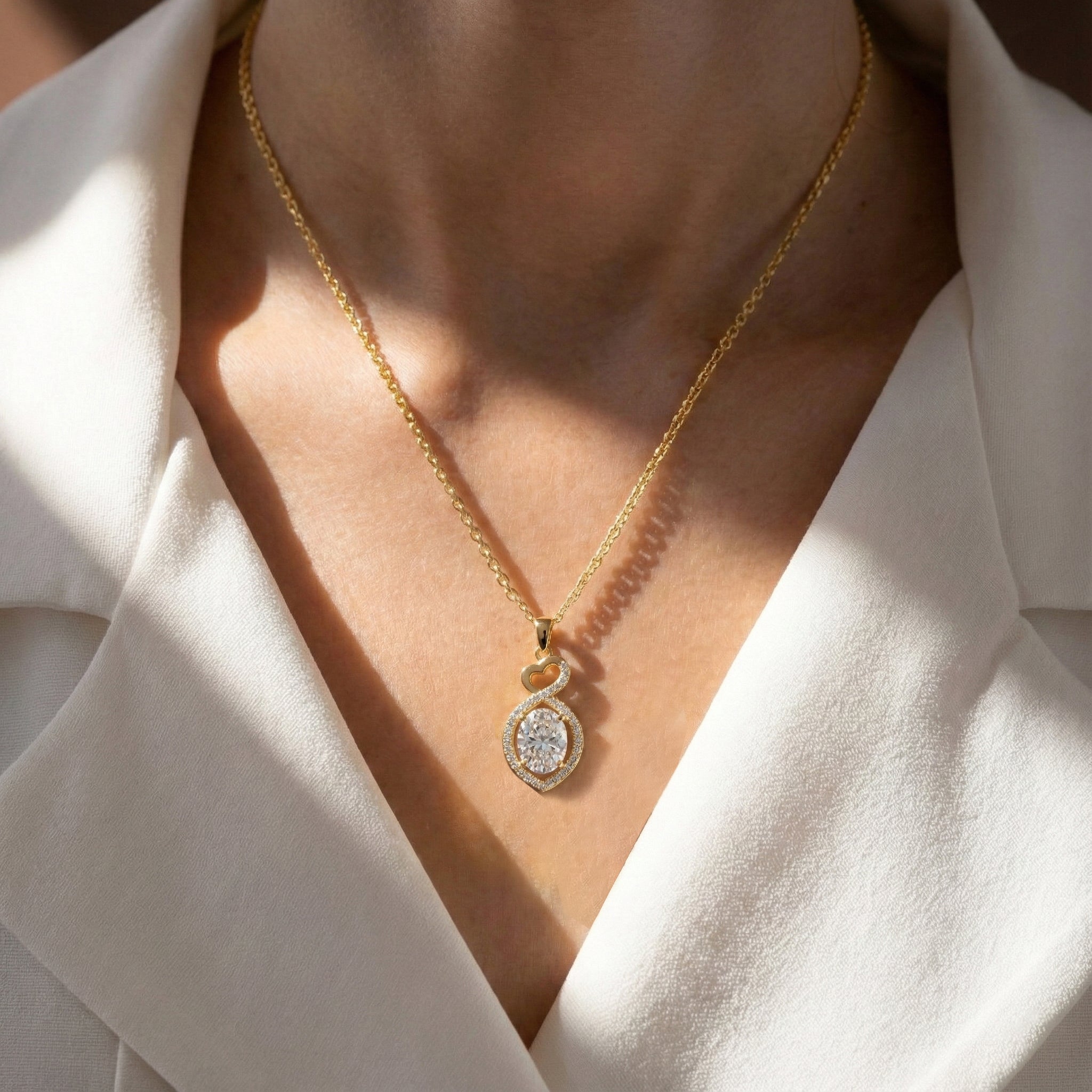 Simulated Diamond Oval Infinity Twist Heart Pendant Necklace in Yellow Gold Plated 1.2ct