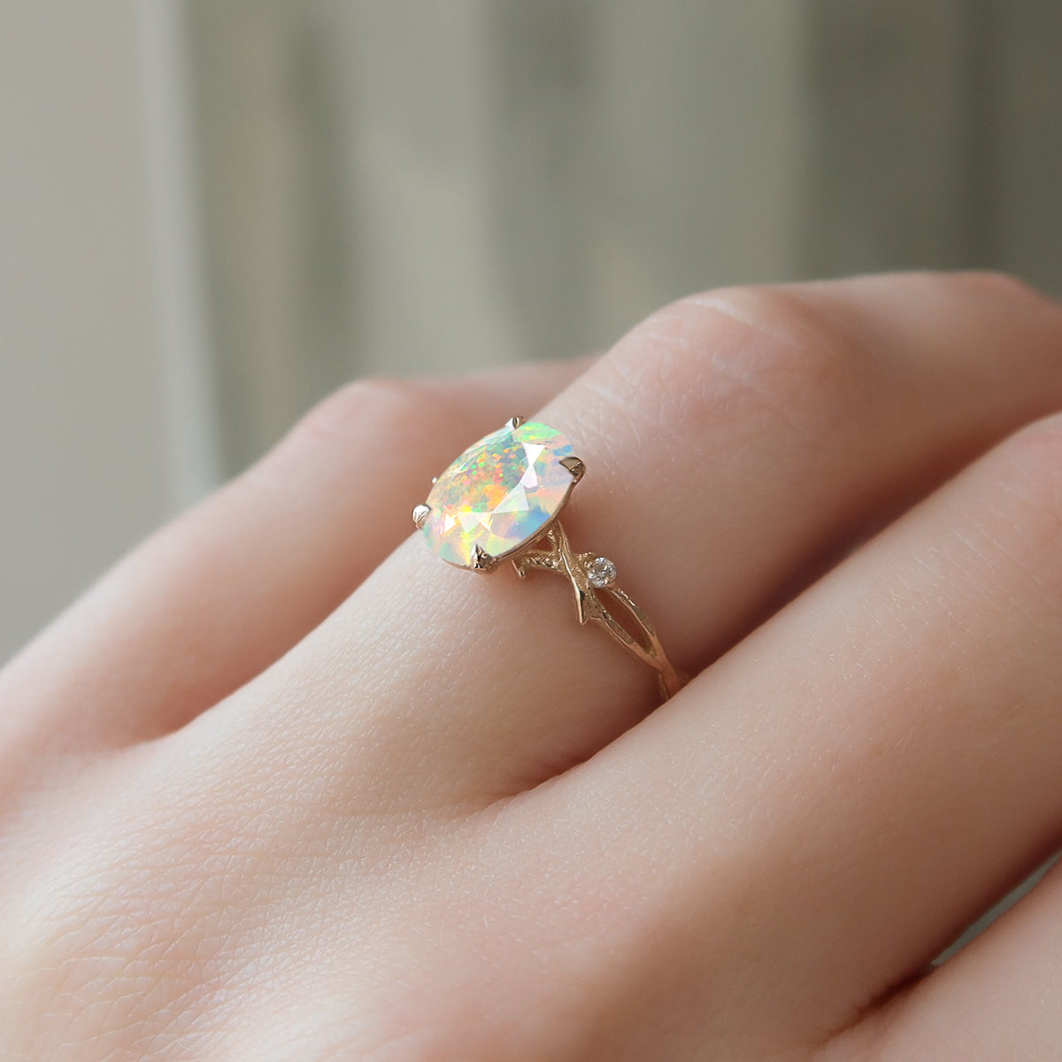 Natural White Opal with Side Stone Crossover Solitaire Ring