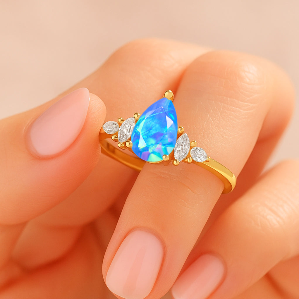 Pear Shape Fire Blue Opal Solitaire Ring with Cubic Zironia