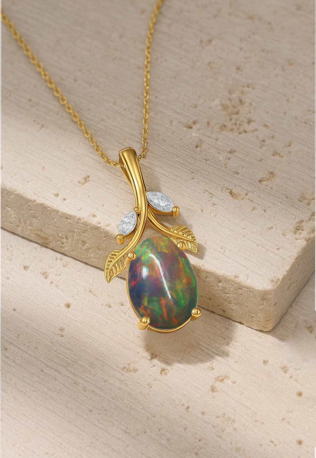 Delicate Oval Leaf Stone Necklace Unique Pendant Design featuring a black opal set in gold with leaf and diamond accents on a fine chain.