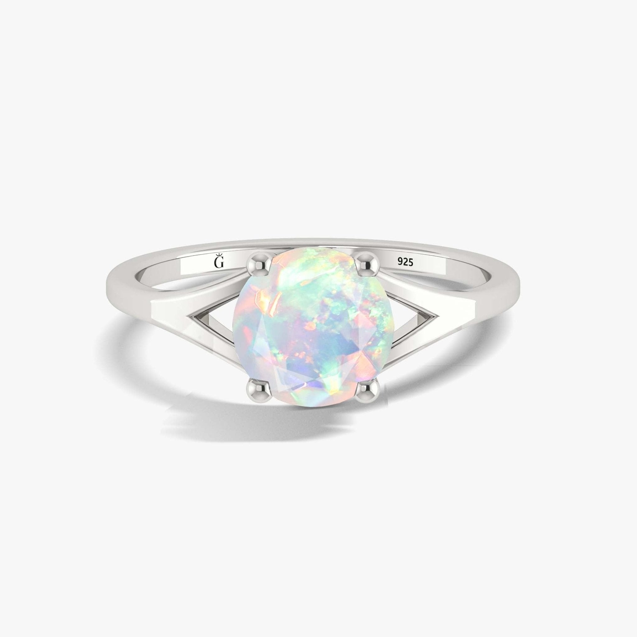 Round white opal solitaire ring in silver band