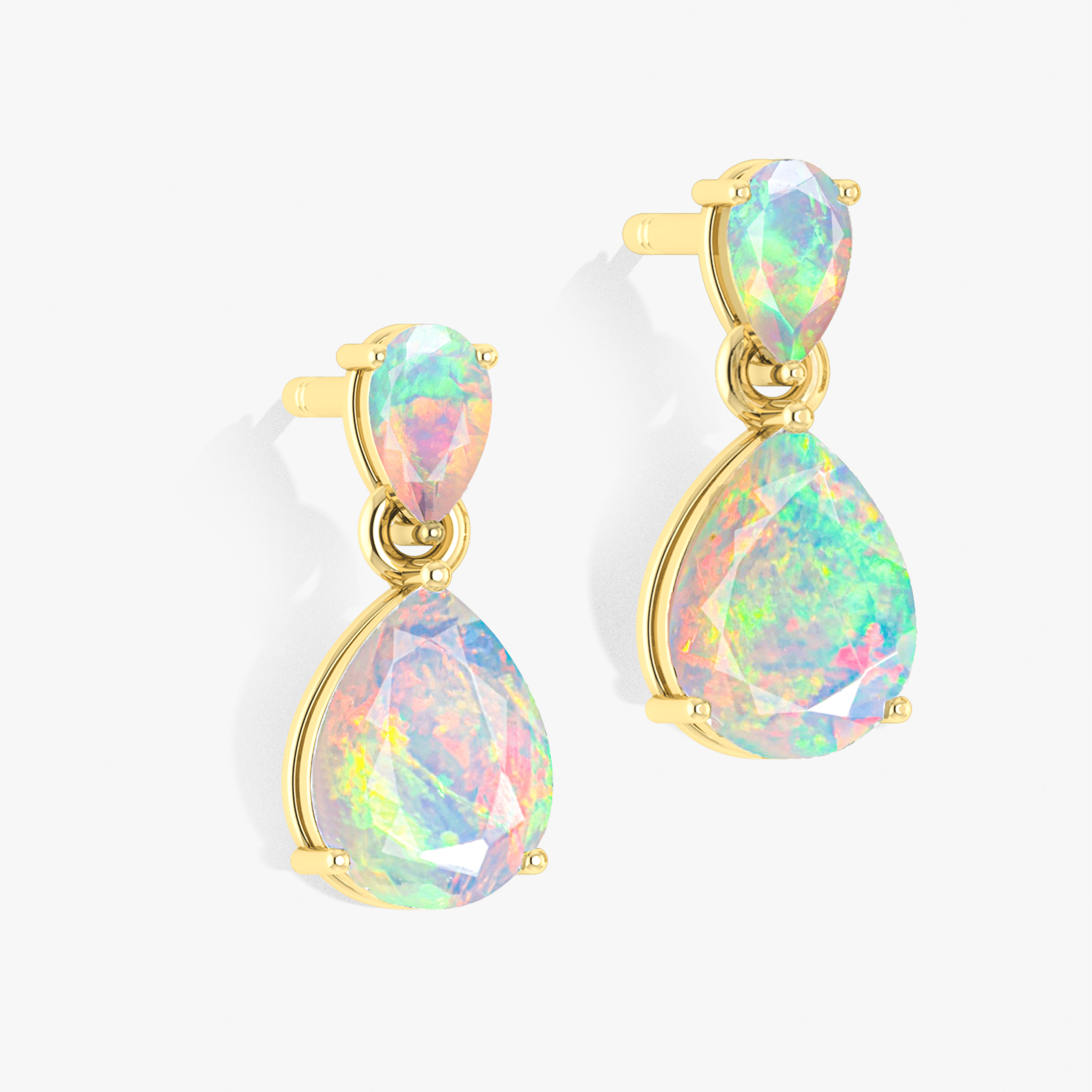 White dual opal pear drop stud earrings featuring elegant gemstone design in sterling silver
